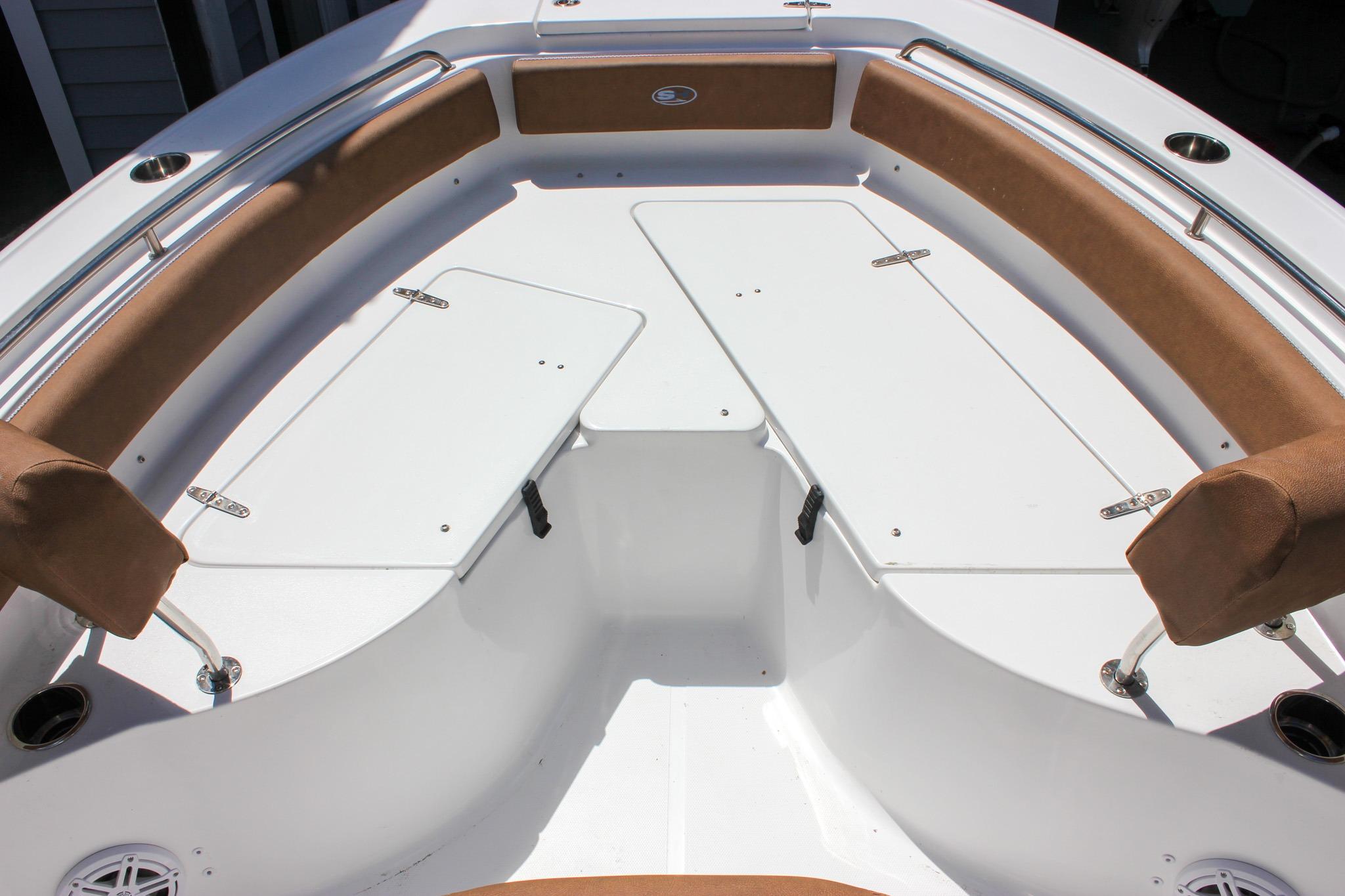 2027 Sea Hunt Ultra 234 boat interior with cushioned seating and storage compartments.
