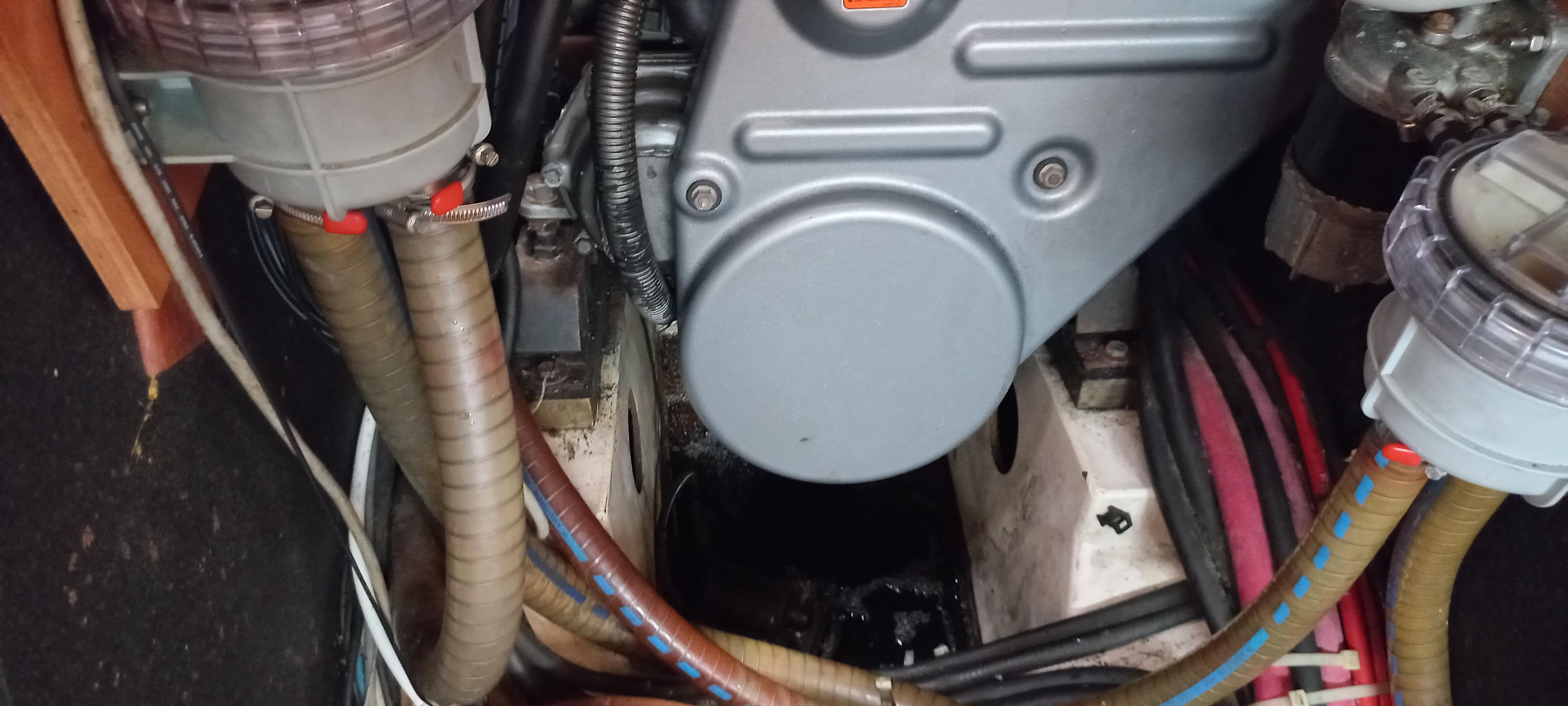 Engine compartment of a 2007 Beneteau Oceanis Clipper 523 sailboat, showing hoses and components.