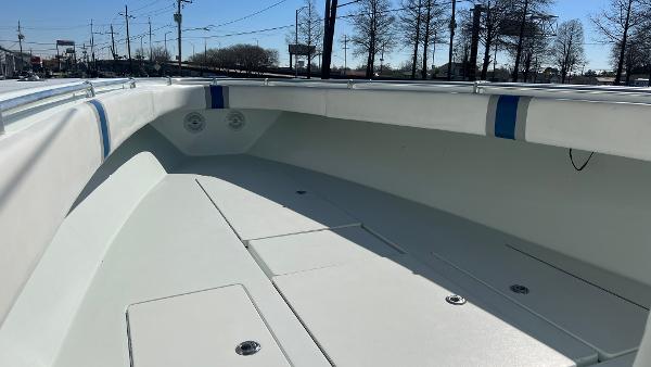 2005 Contender 36 Open boat deck with storage compartments and seating.