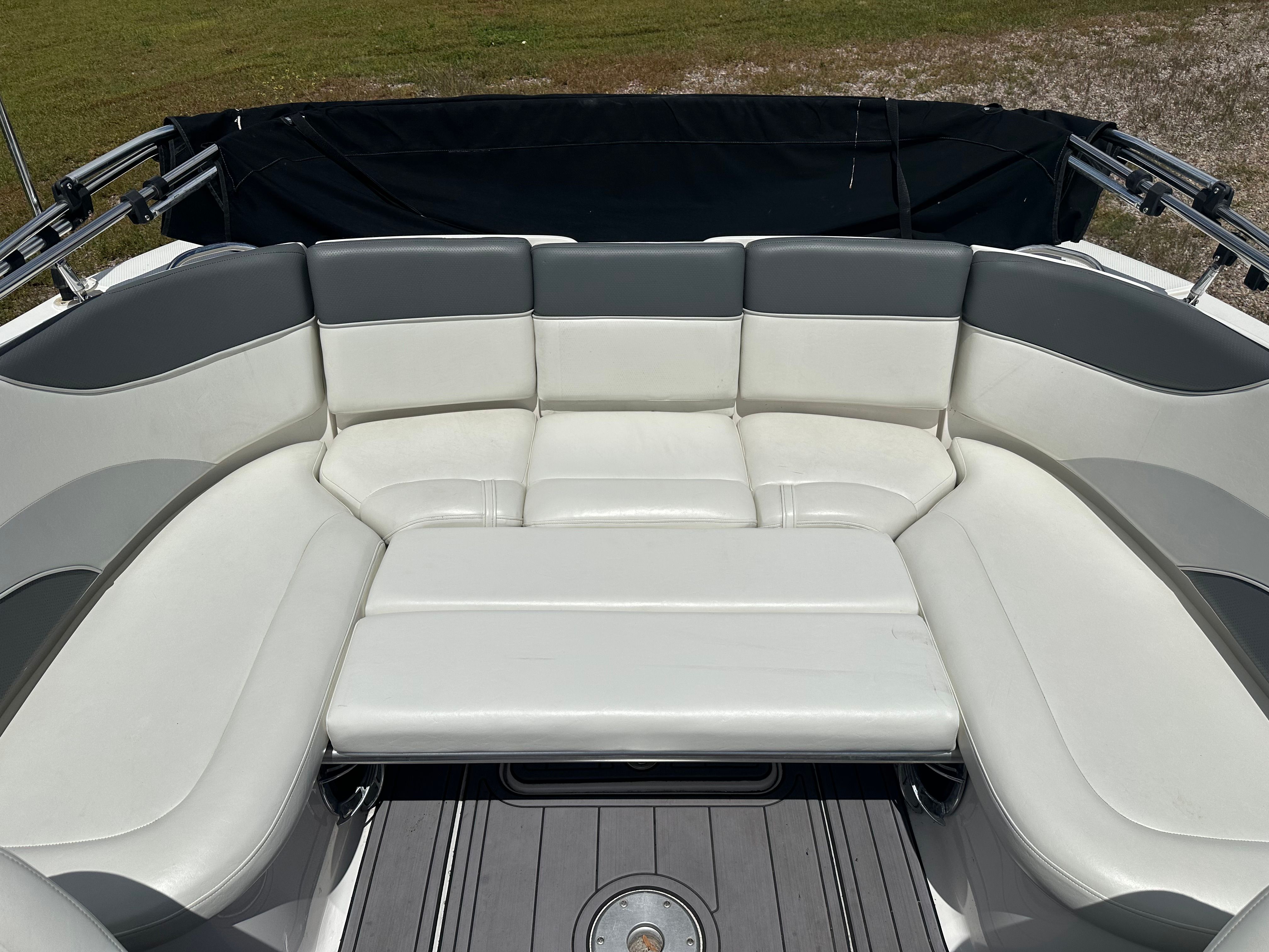 Interior of a 2005 Yamaha AR230 HO boat with white seating.