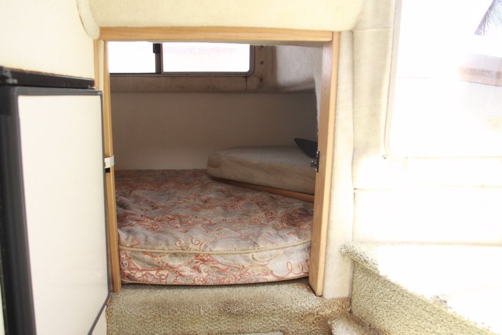 Interior of 1999 Maxum 2400 Mercruiser with sleeping area.