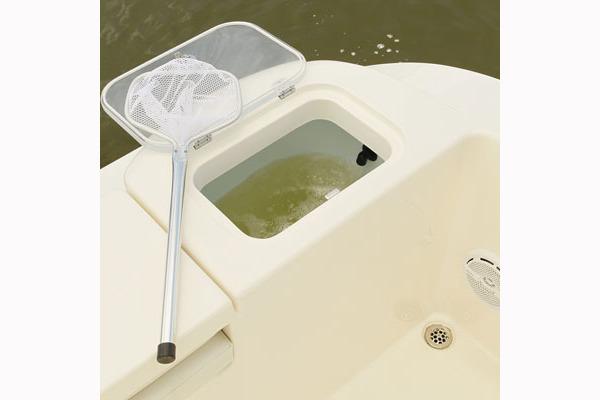 Manufacturer Provided Image: 2018 Cobia 201 Center Console boat with a livewell and fishing net.