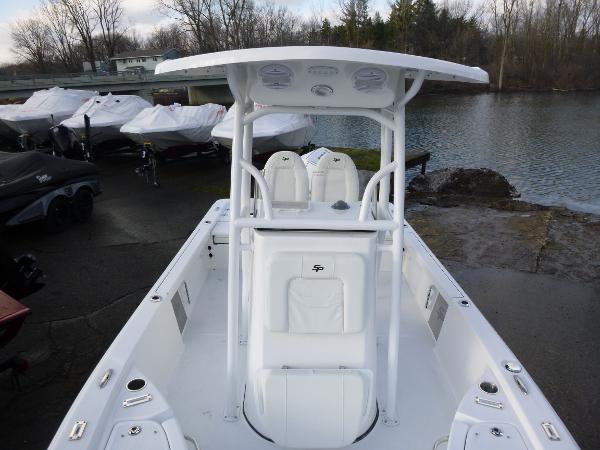 2025 Sea Pro 230 Bay boat docked by a serene lake.