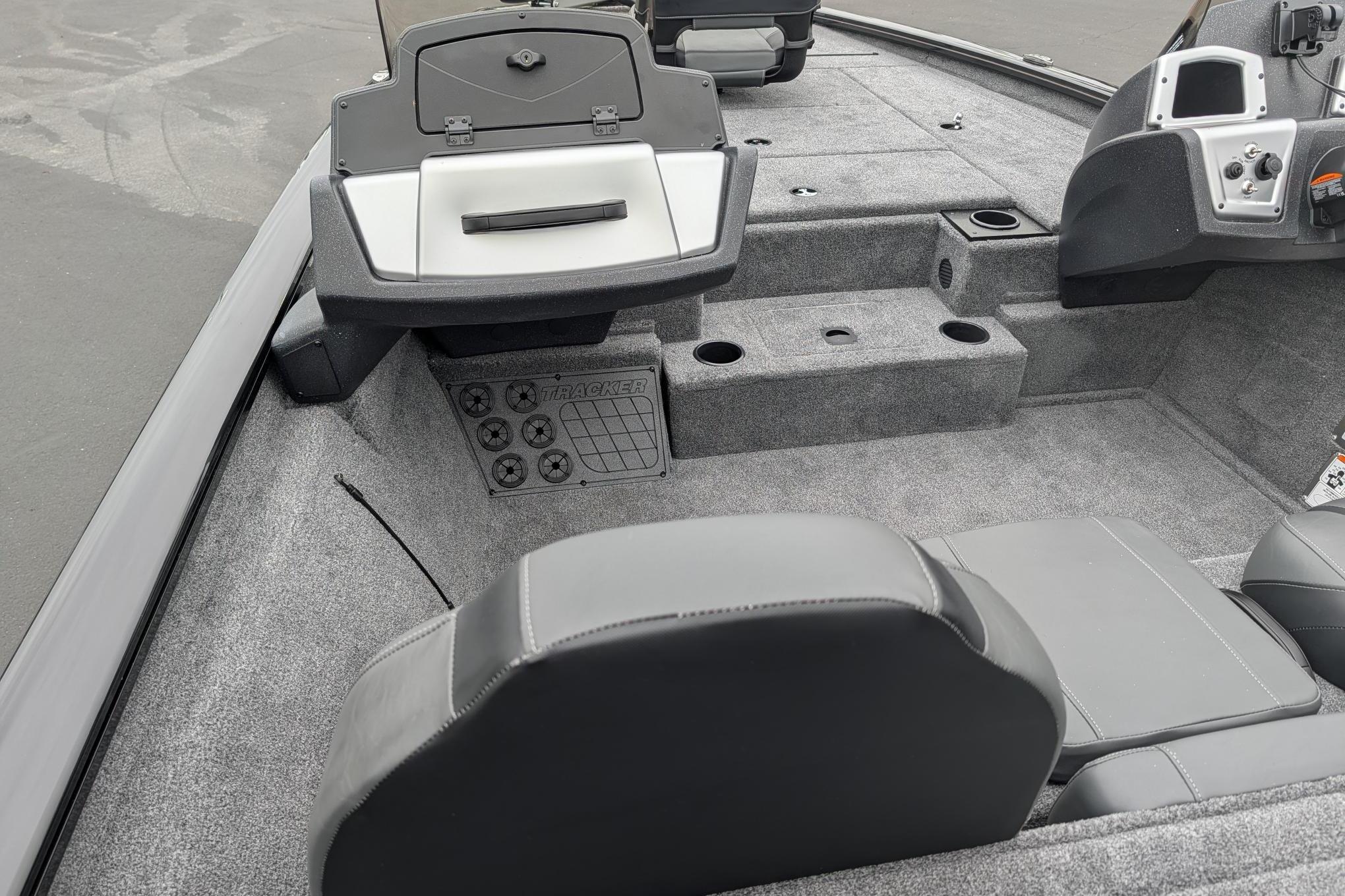 Interior of a 2026 Tracker Pro Team 195 TXW boat, featuring seating and storage compartments.