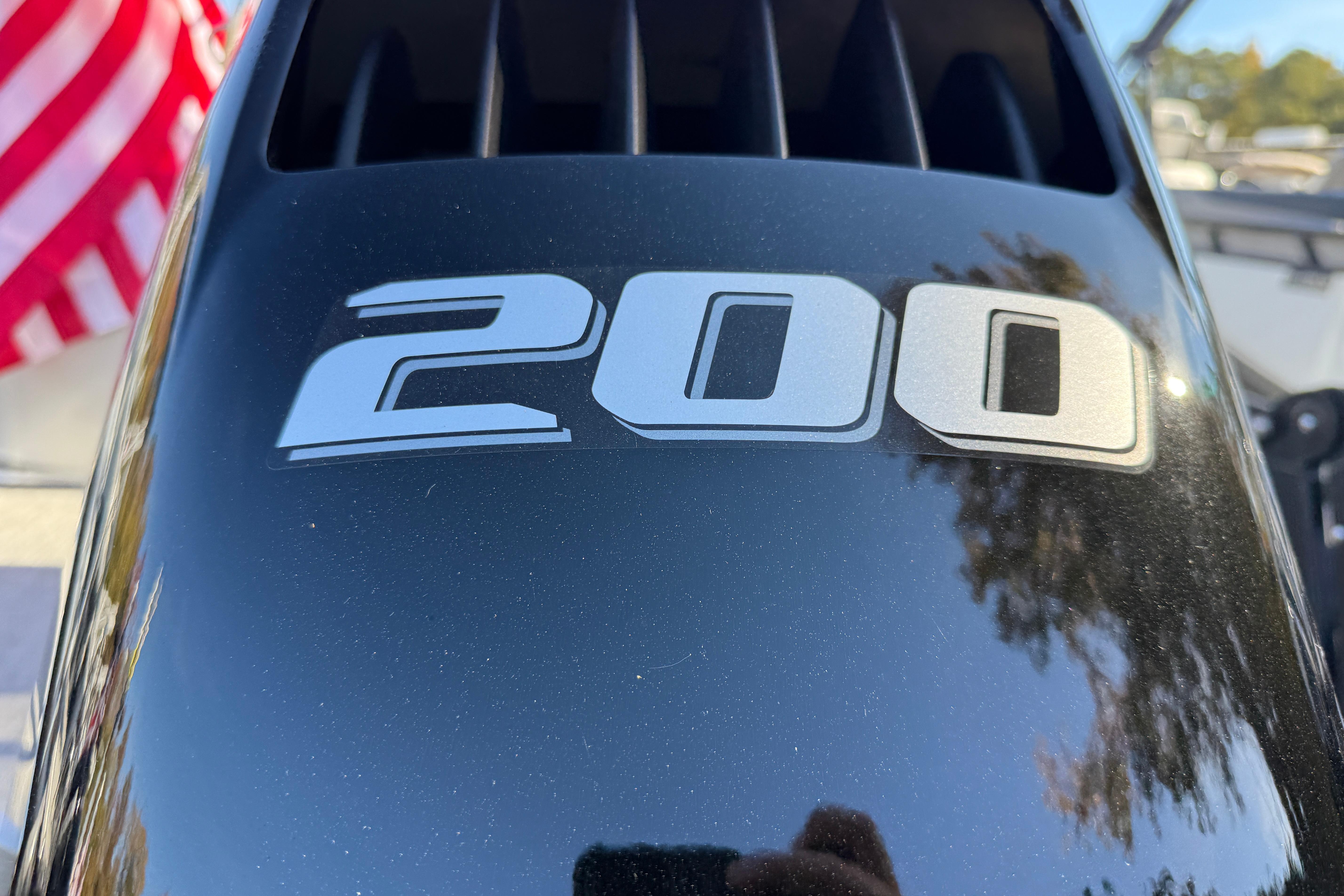 Close-up of 200 horsepower engine on 2026 Tahoe Pontoon LTZ Quad Lounger.