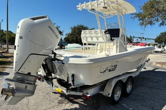 2026 Mako 24 APEX boat with Mercury engine on a trailer.