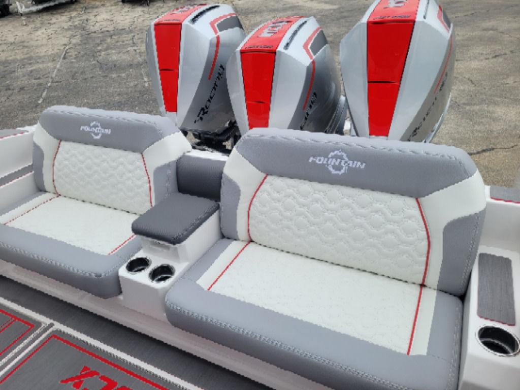 2024 Fountain 38 SCX boat seats with triple engines, featuring gray and white upholstery.