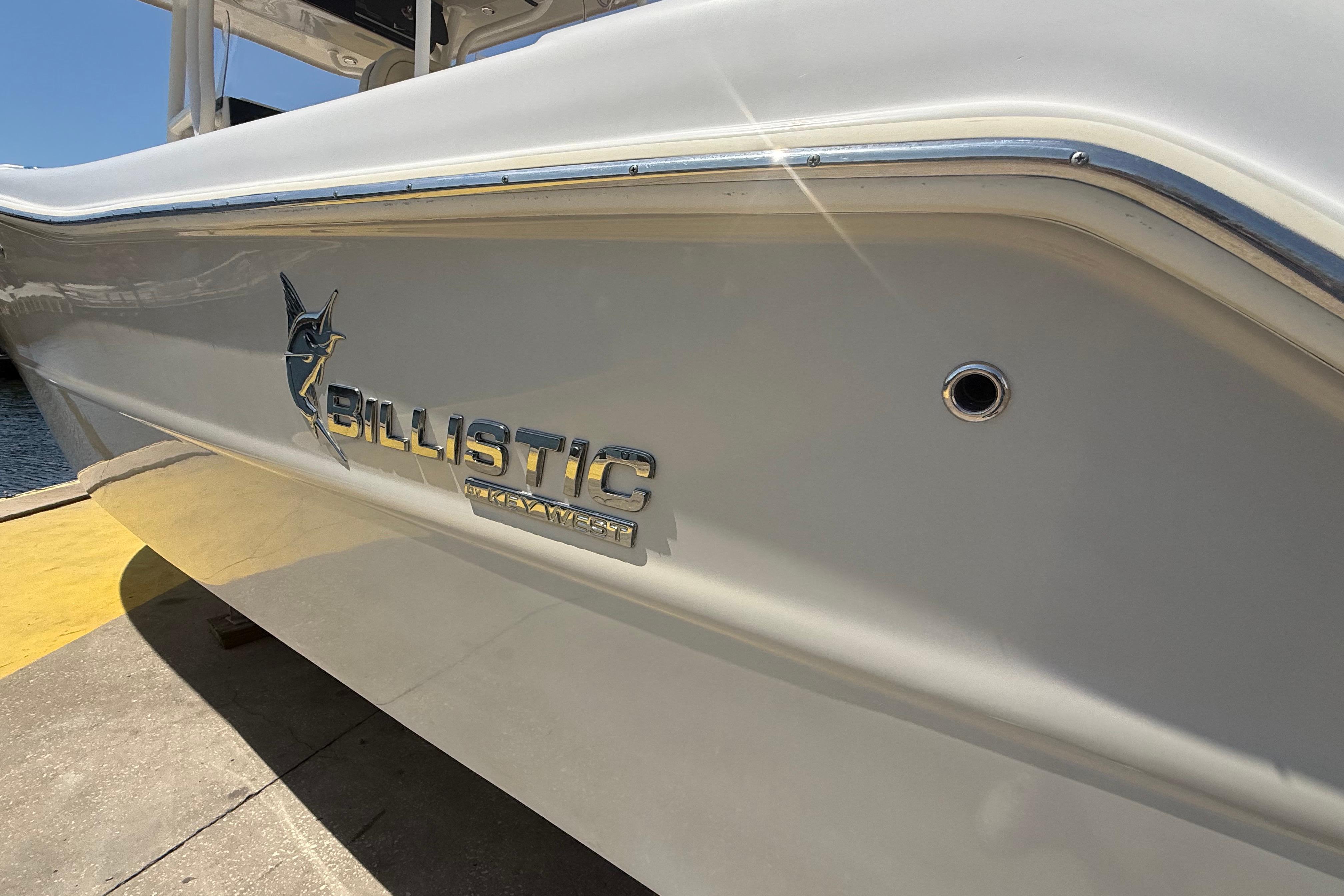 2019 Key West Billistic 281 Center Console boat side view with logo.