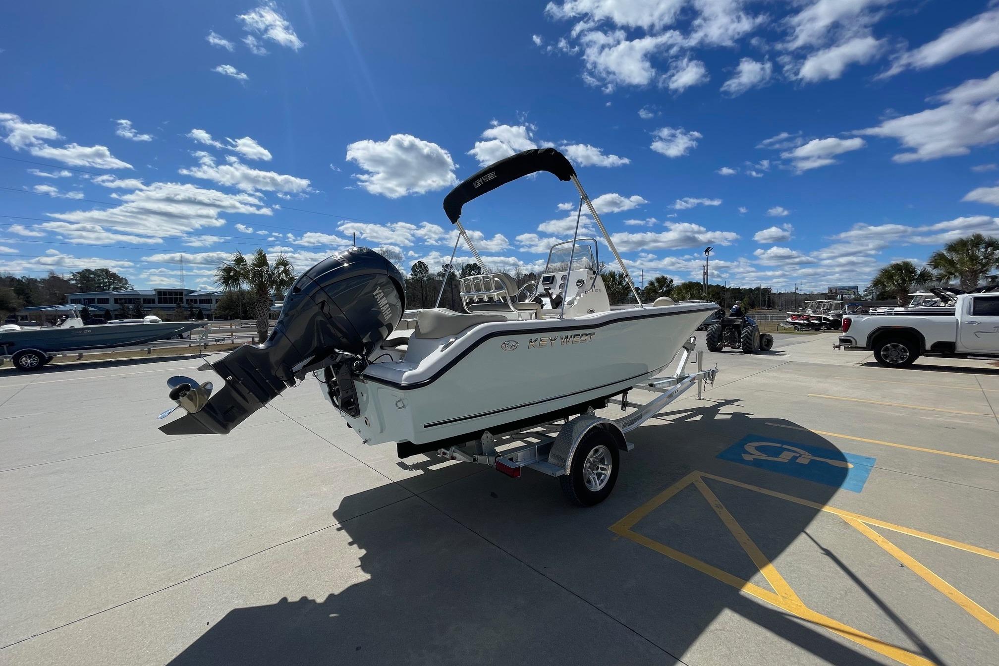 2026 Key West 203 FS boat on trailer under blue sky.