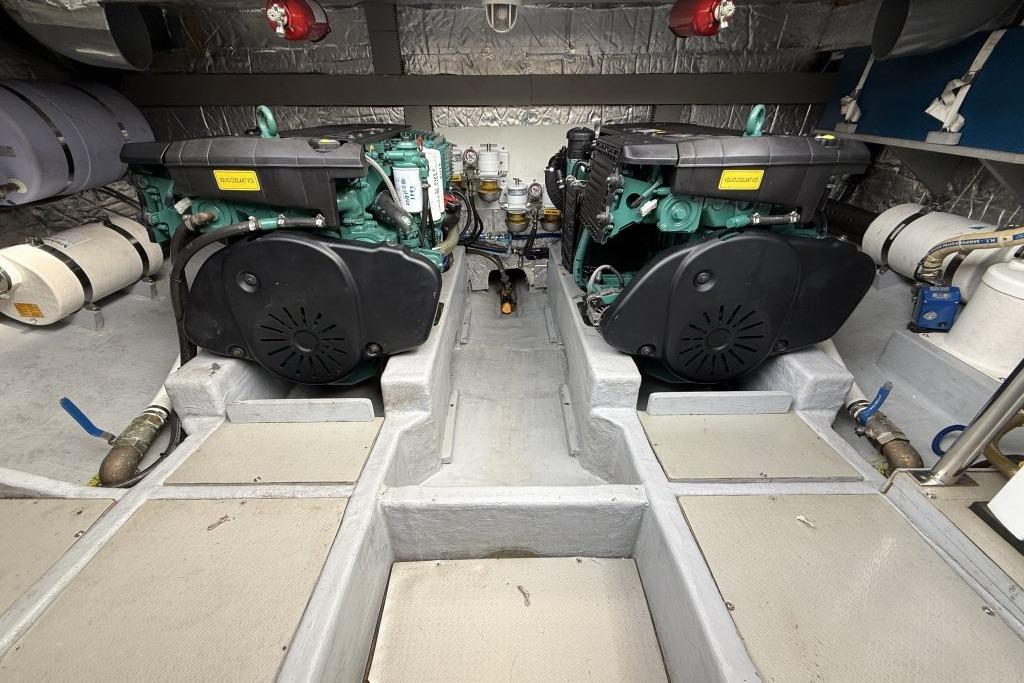 Engine room of 2012 Sasga Yachts Menorquin 42 with dual engines and equipment.