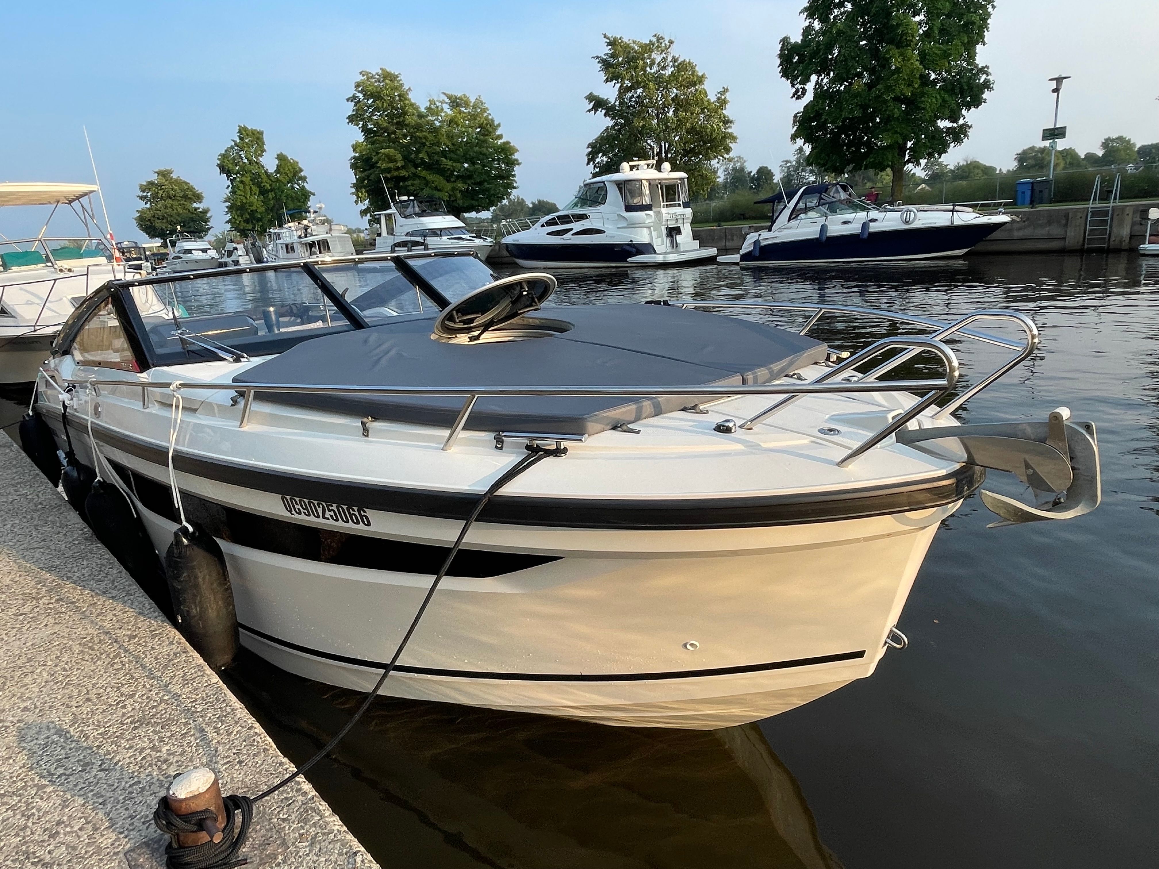2022 Parker Poland 800 Cruiser docked, featuring a sleek design and gray cover.