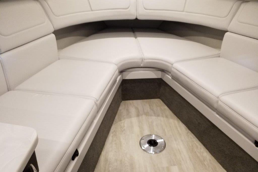 Interior seating of 2021 Formula 350 Sun Sport boat, featuring plush white upholstery.
