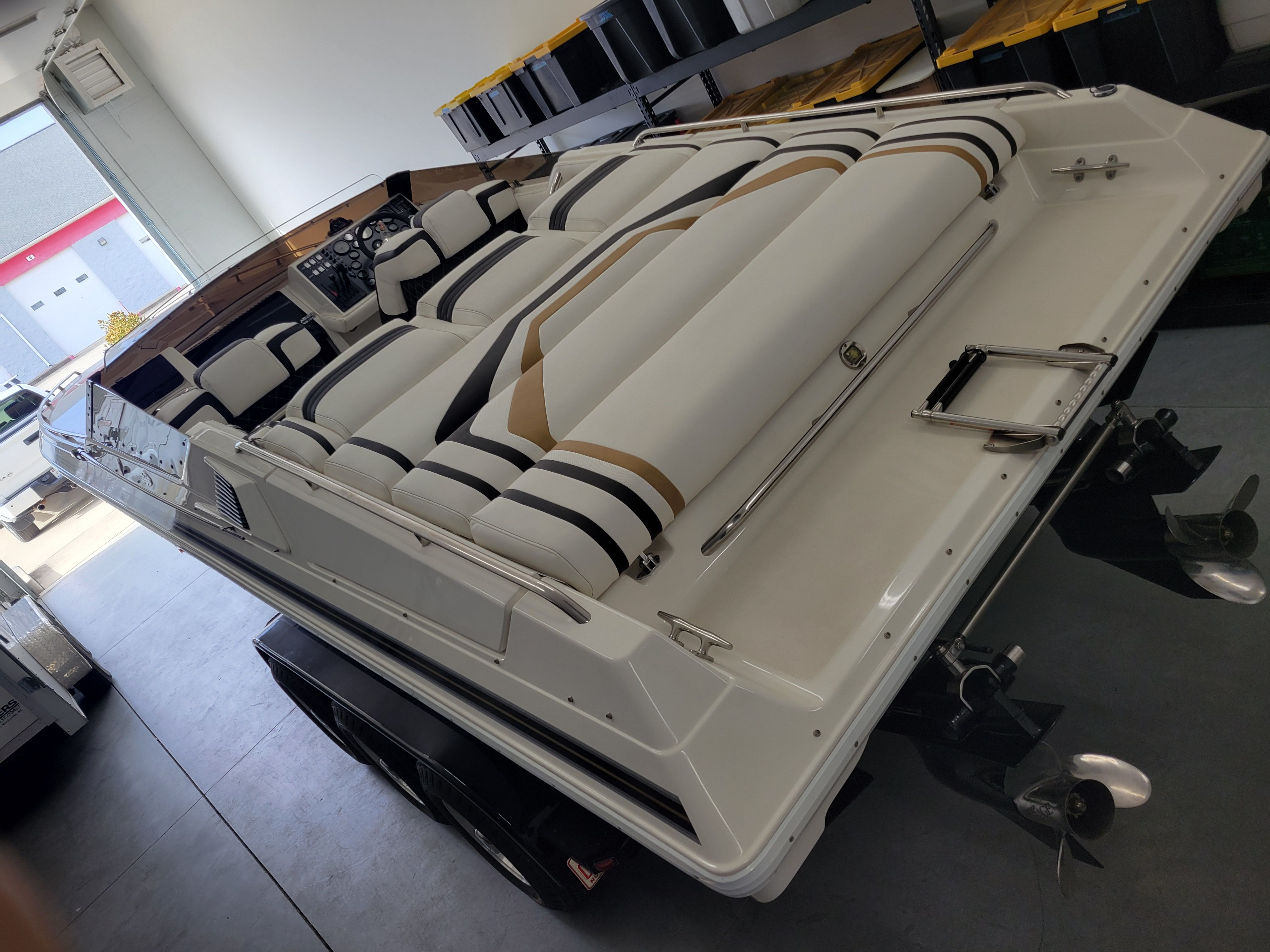 1992 Fountain Fever boat with sleek white and striped upholstery in a garage setting.