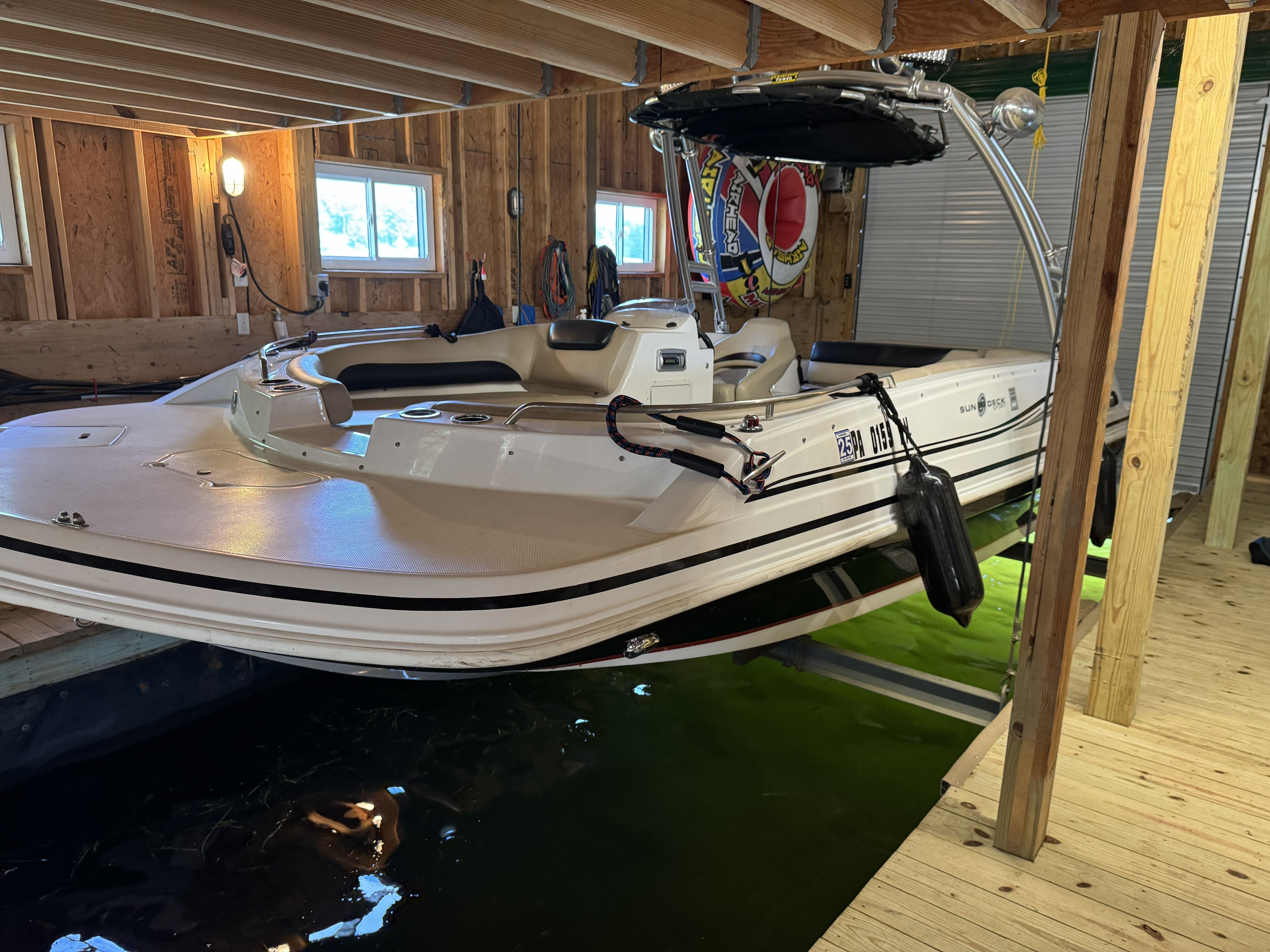A 2014 Hurricane SS201 I/O boat in a covered dock.