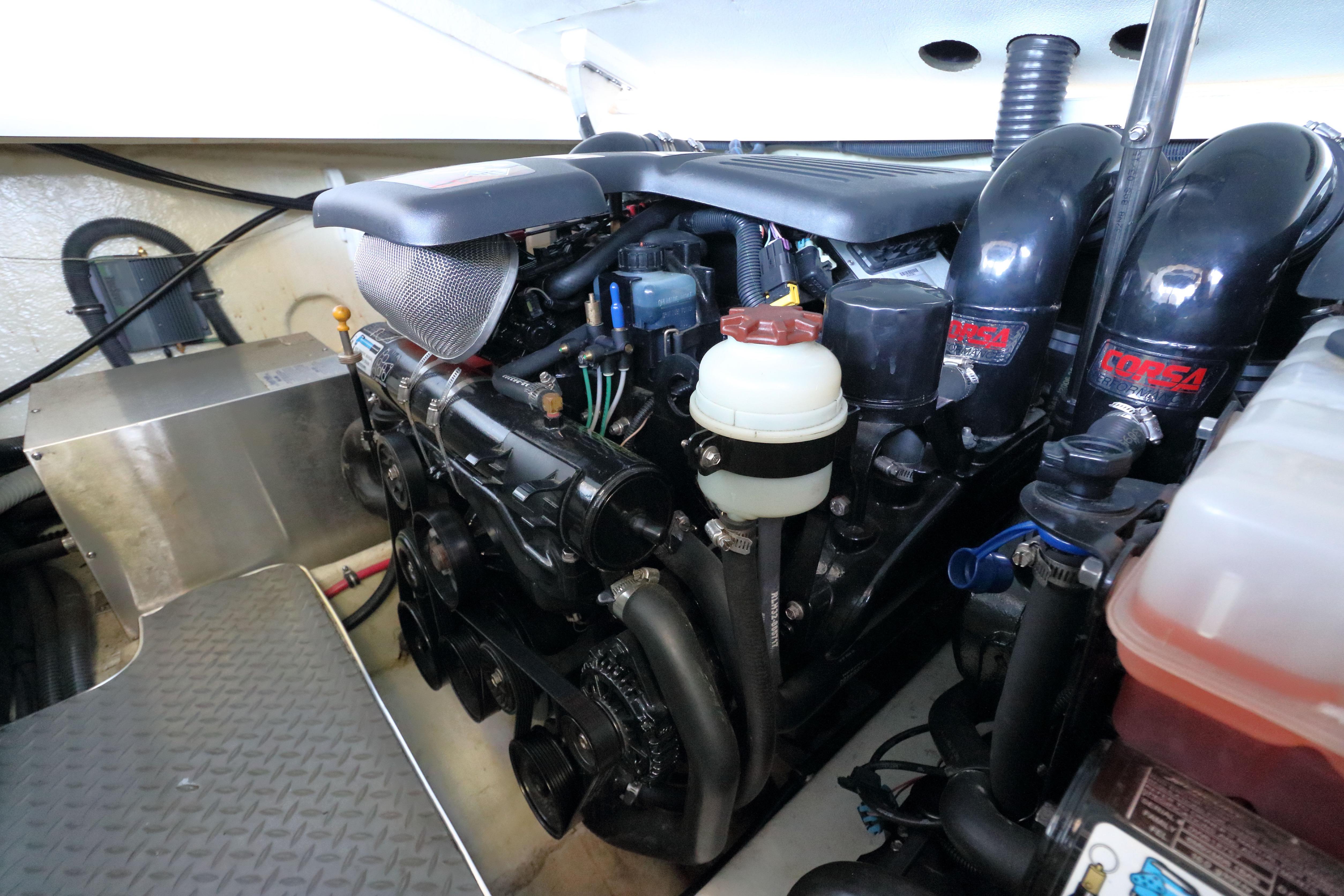 Engine compartment of a 2006 Formula 330 Sun Sport boat, featuring Corsa components.