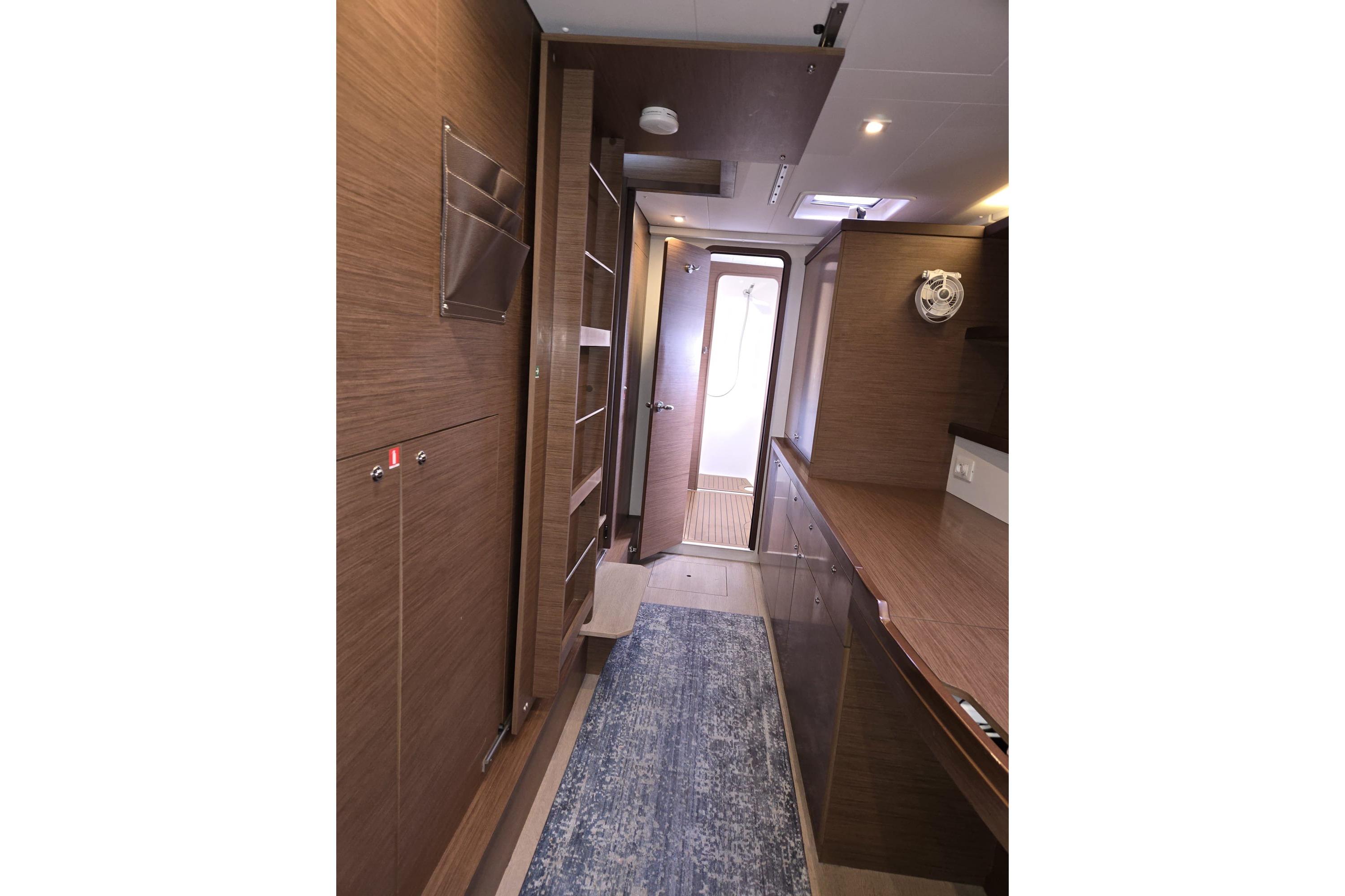 Interior of 2020 Lagoon 42 yacht, featuring modern wood paneling and sleek design.
