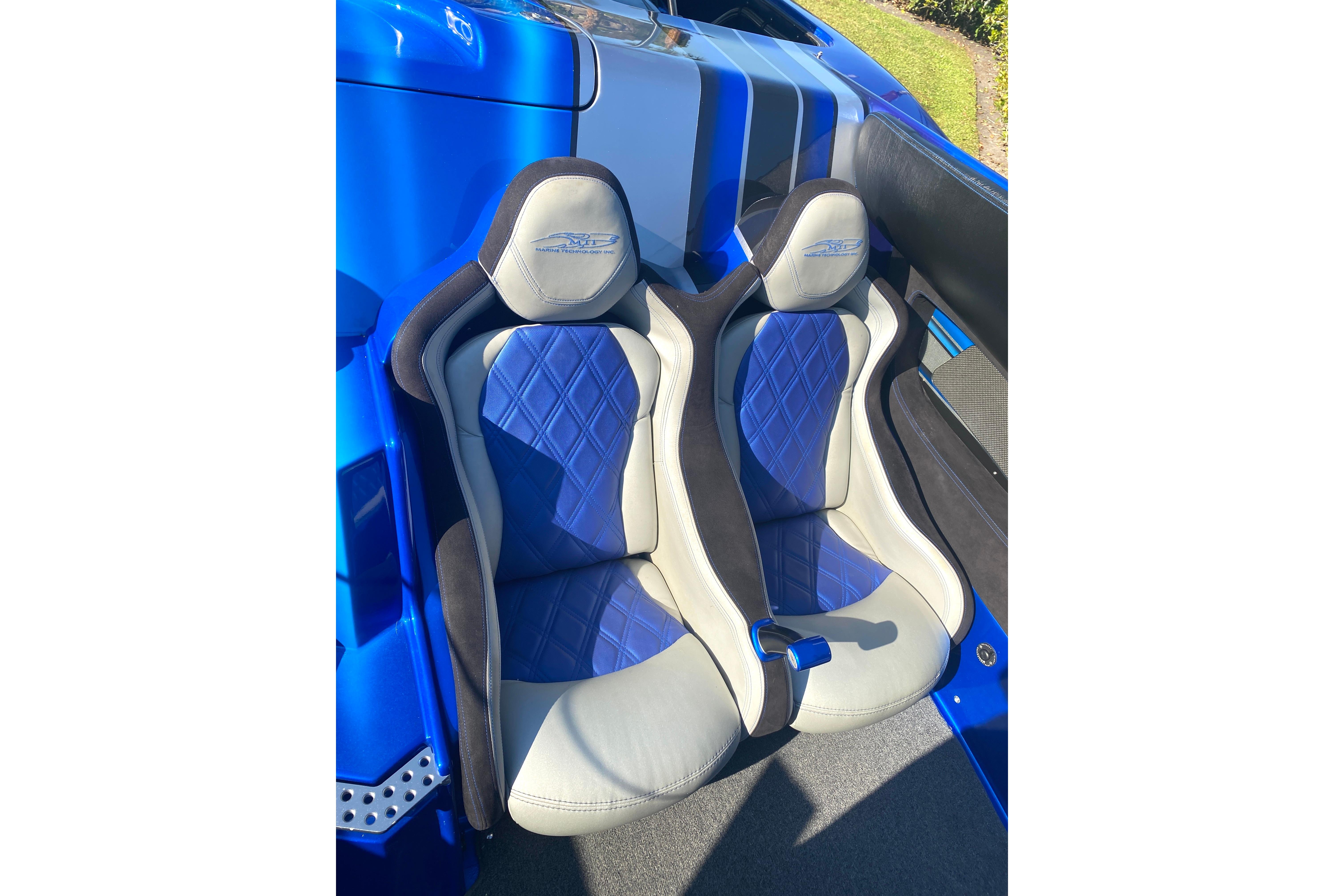 Blue and gray racing seats in a 2016 MTI 44 RP boat.