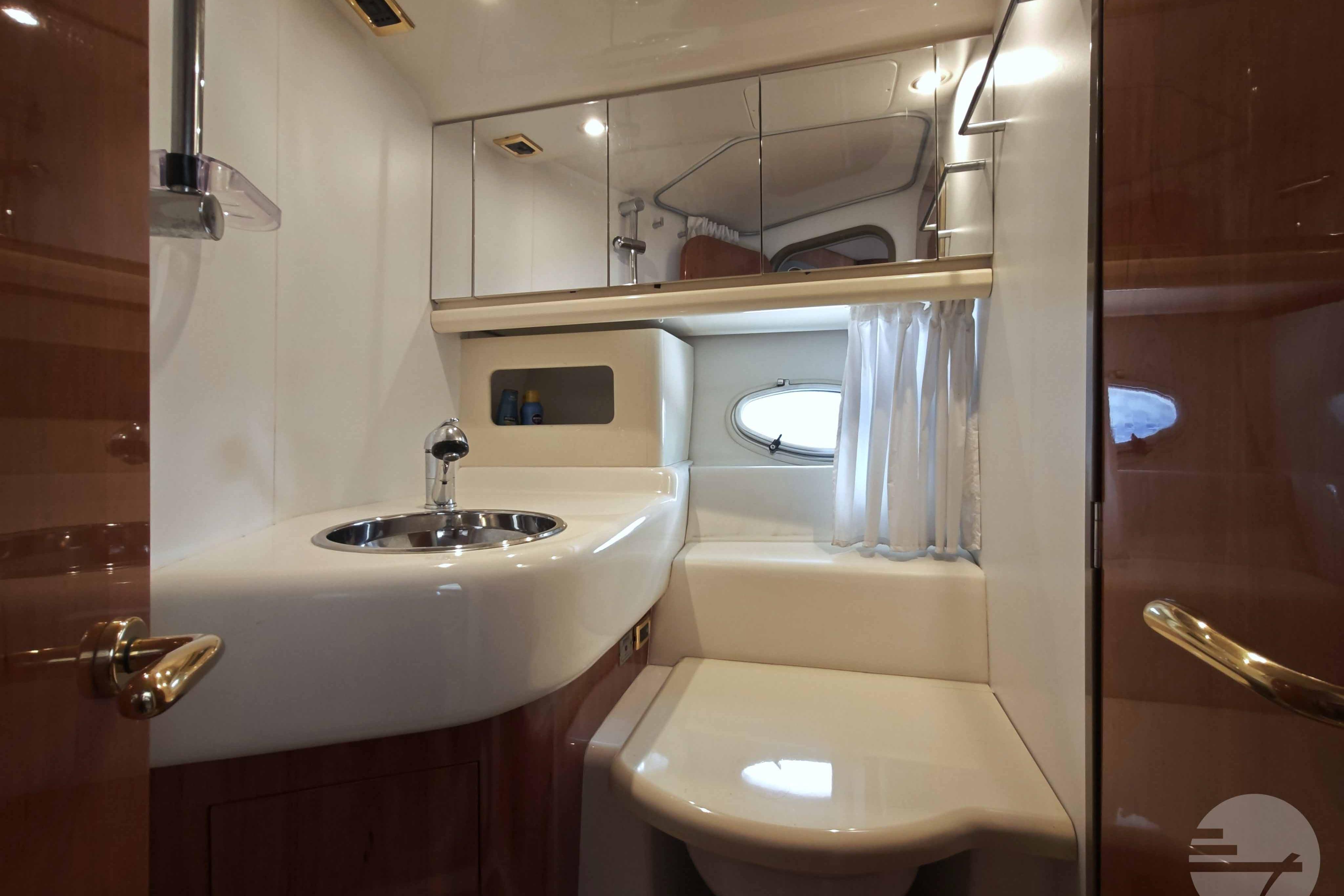 Luxurious bathroom interior of 2007 Cranchi Atlantique 40 yacht with modern fixtures.