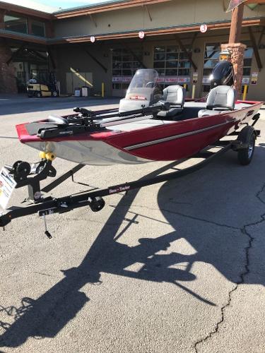 2025 Tracker Bass Tracker Classic XL boat on trailer, parked outside a building.