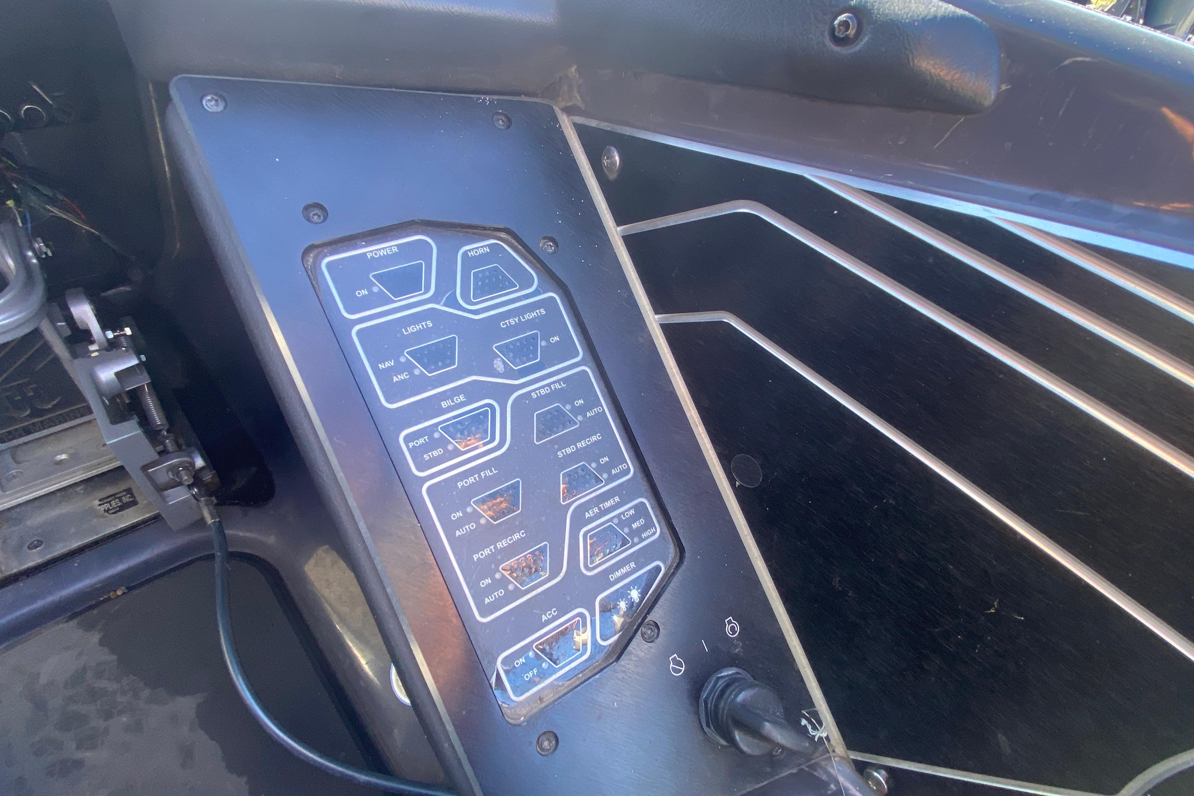 Control panel of a 2020 Skeeter FXR20 Limited boat with labeled switches.