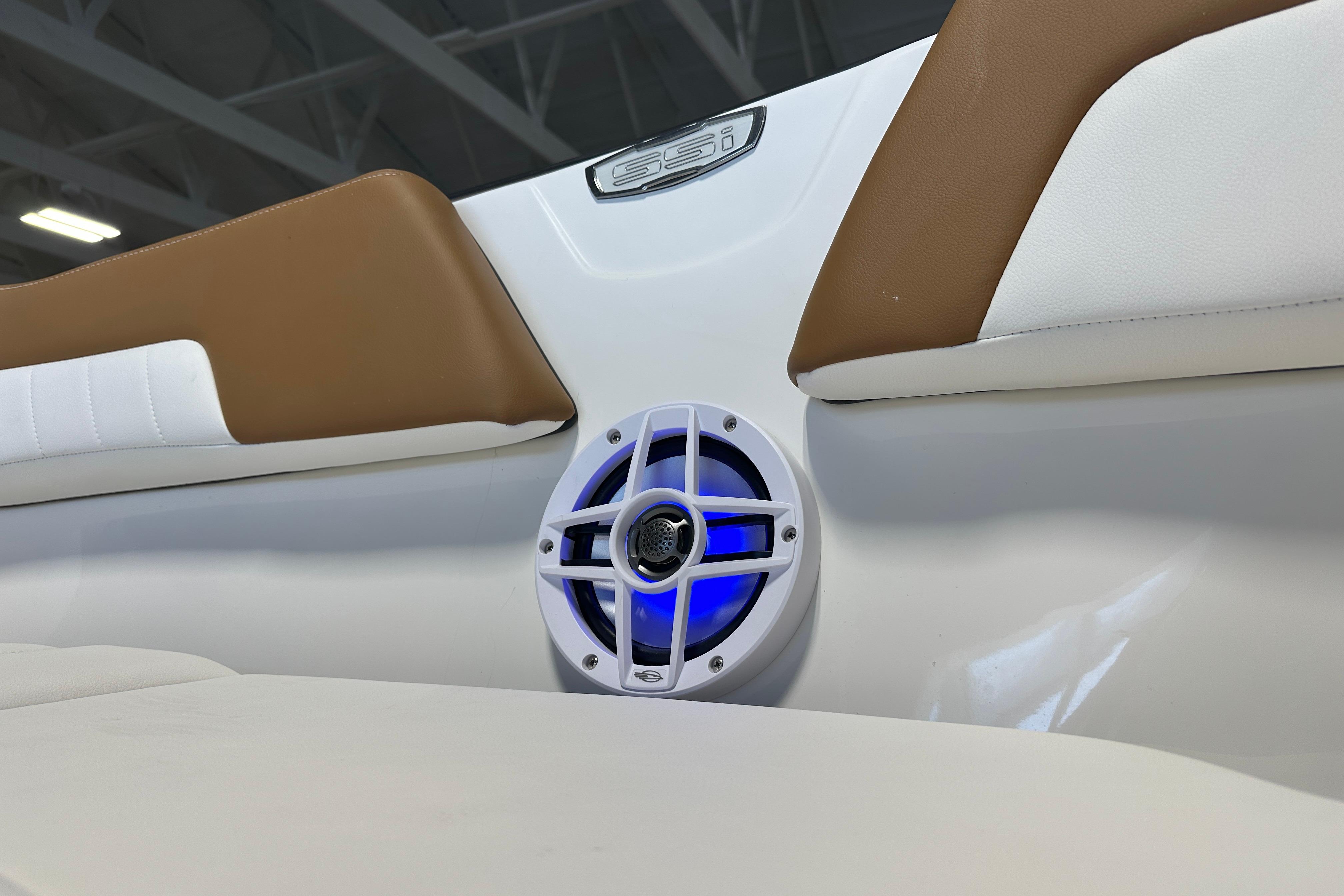 Chaparral 23 SSi 2026 boat with blue-lit speaker.