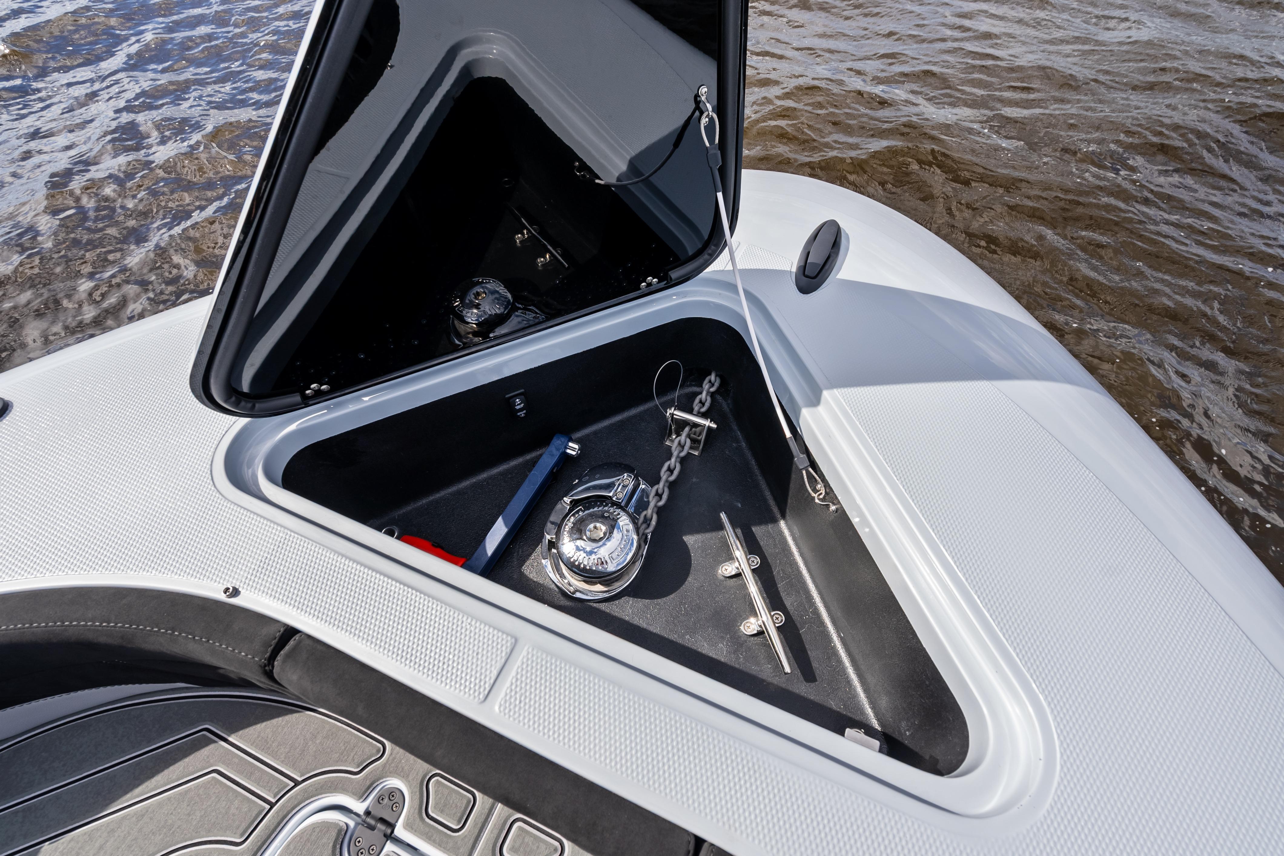 Open anchor compartment on 2027 Mystic Powerboats M4200, showcasing marine equipment.