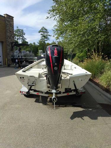 2024 Ranger RB200 boat with outboard motor, parked outdoors on a sunny day.