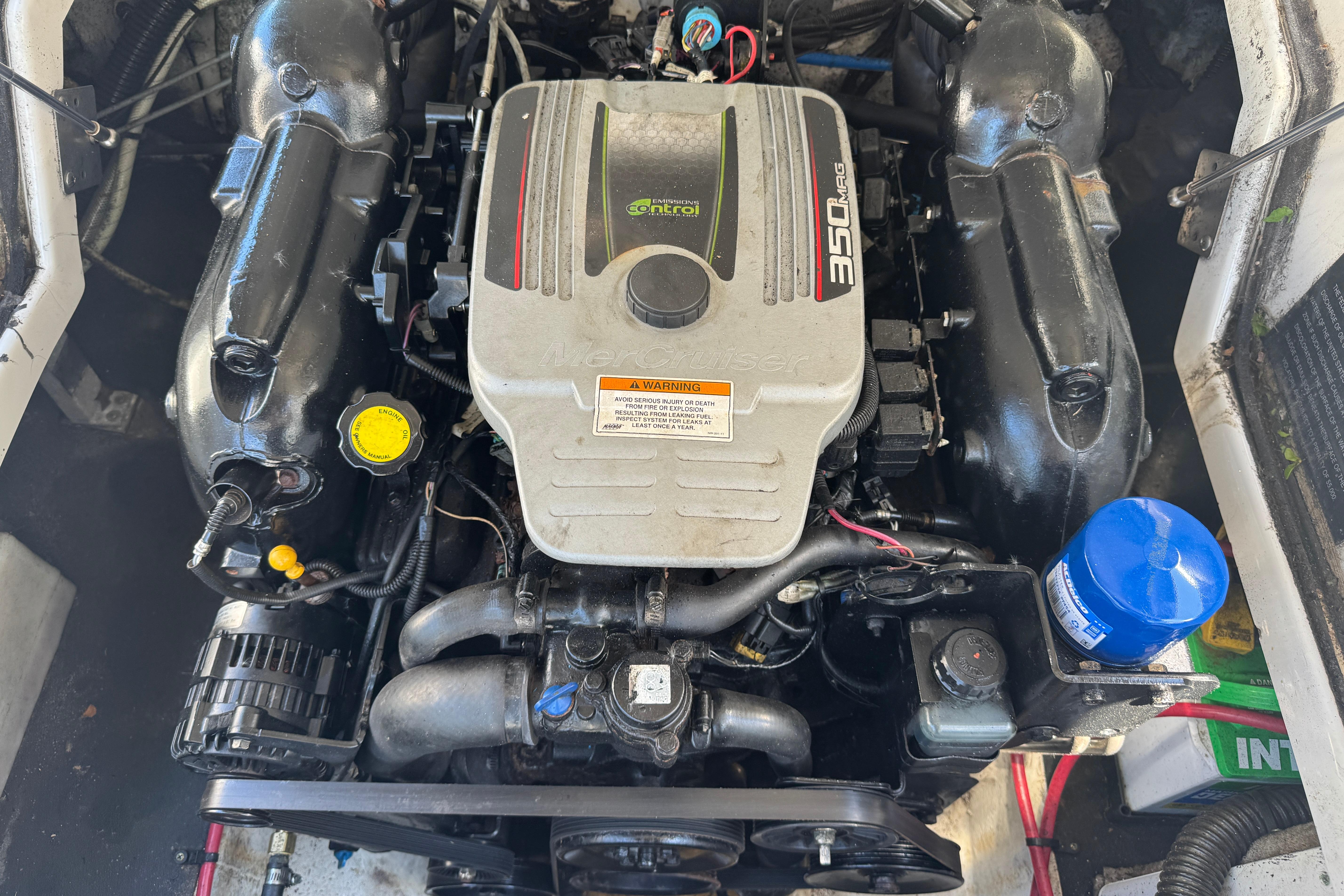Engine of a 2013 Crownline Eclipse E6 XS boat, featuring a 350 MAG motor.