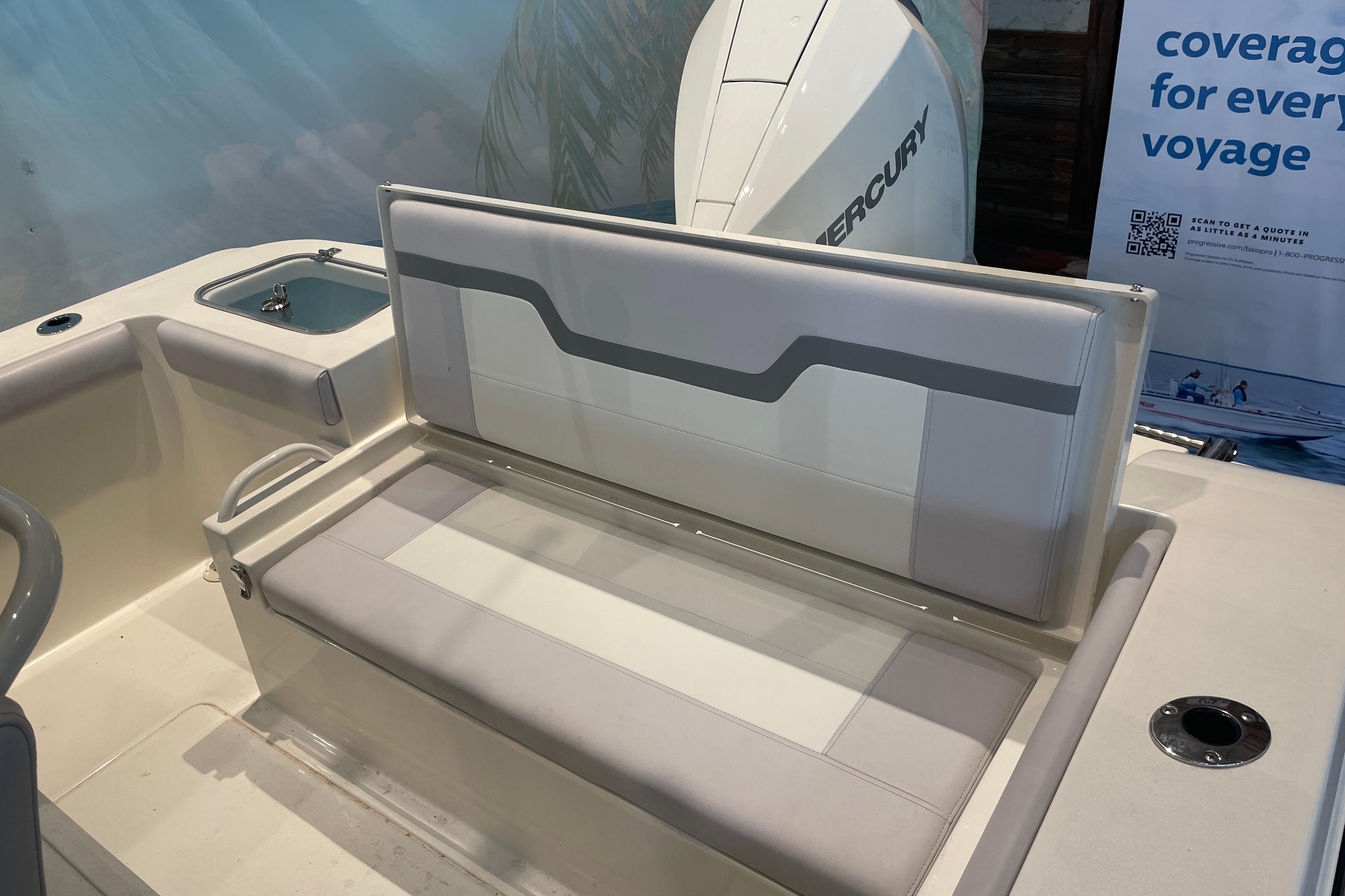 2026 Mako 226 Center Console boat interior with seating and Mercury engine.