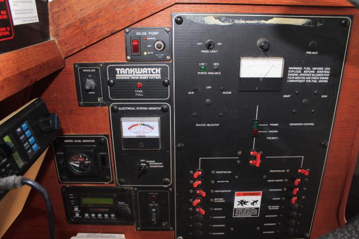 Control panel of a 1992 Bayliner 3288 Motoryacht with various monitoring systems.