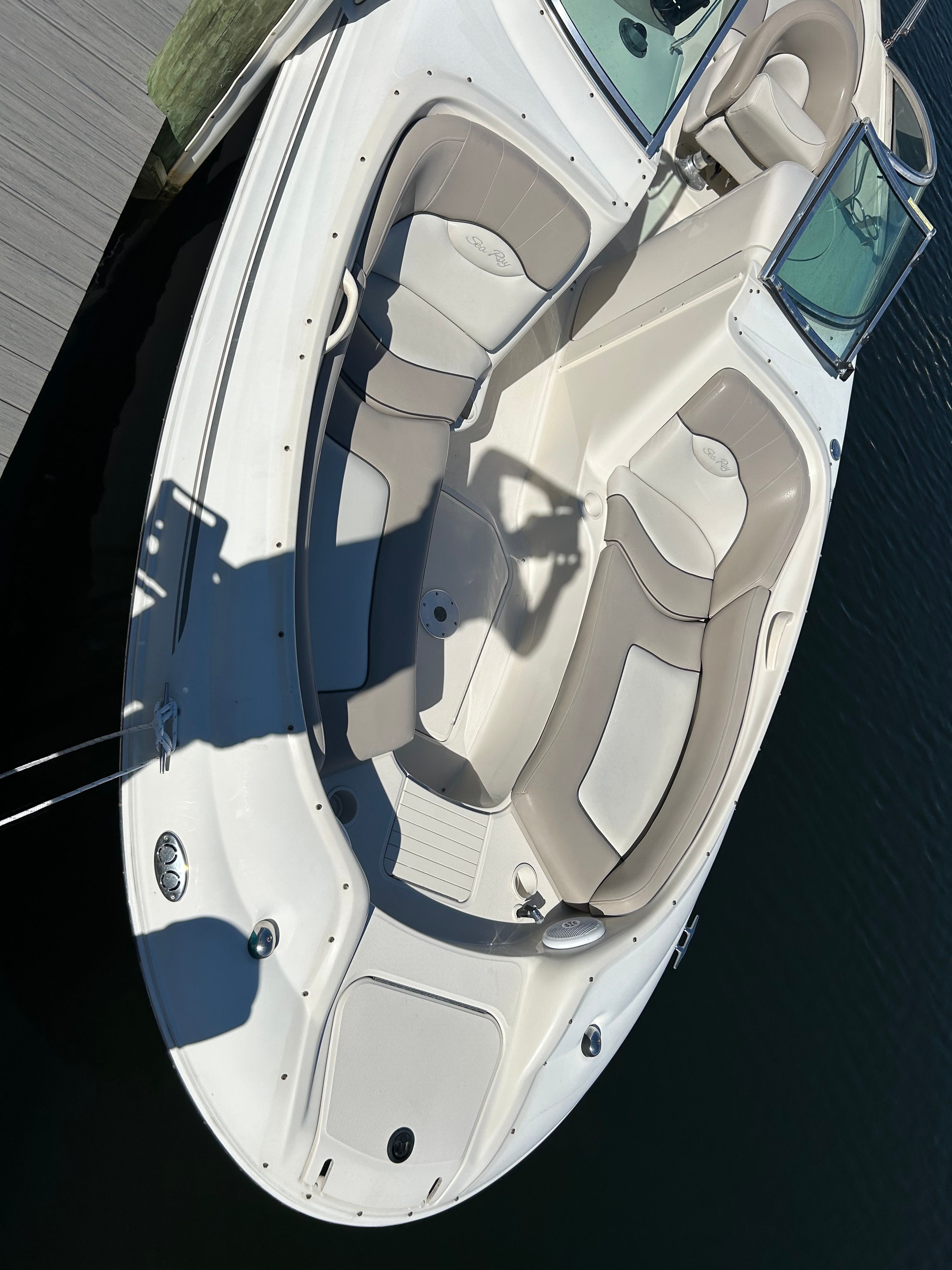 2003 Sea Ray 240 Sundeck boat at dock.