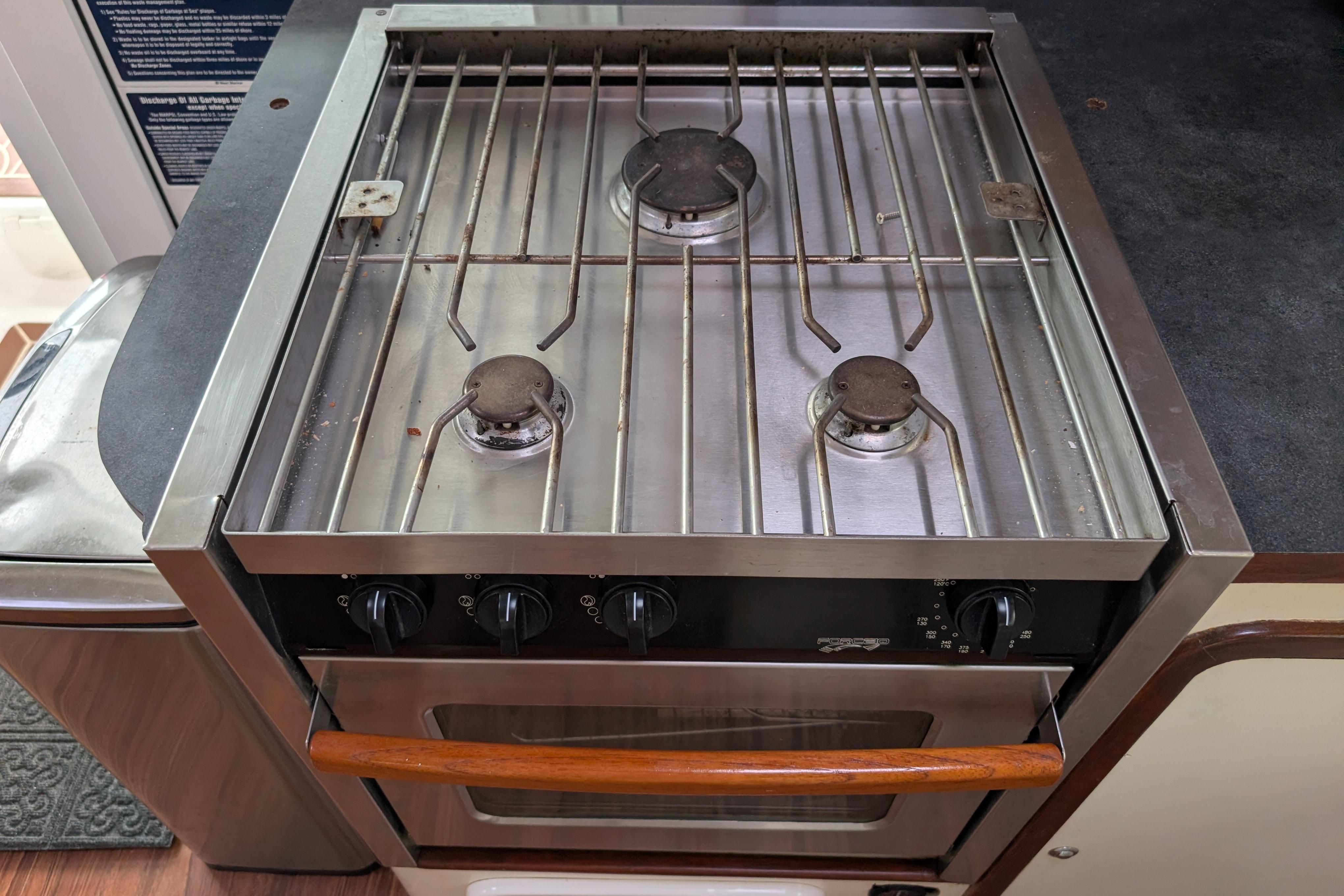 Stainless steel stove and oven in 1999 Island Spirit 37 yacht kitchen.