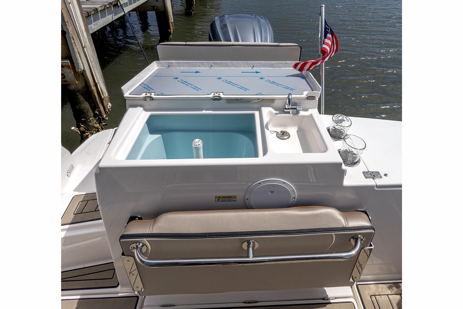 Manufacturer Provided Image: 2023 Cutwater C-248 Coupe boat with outdoor sink and American flag.