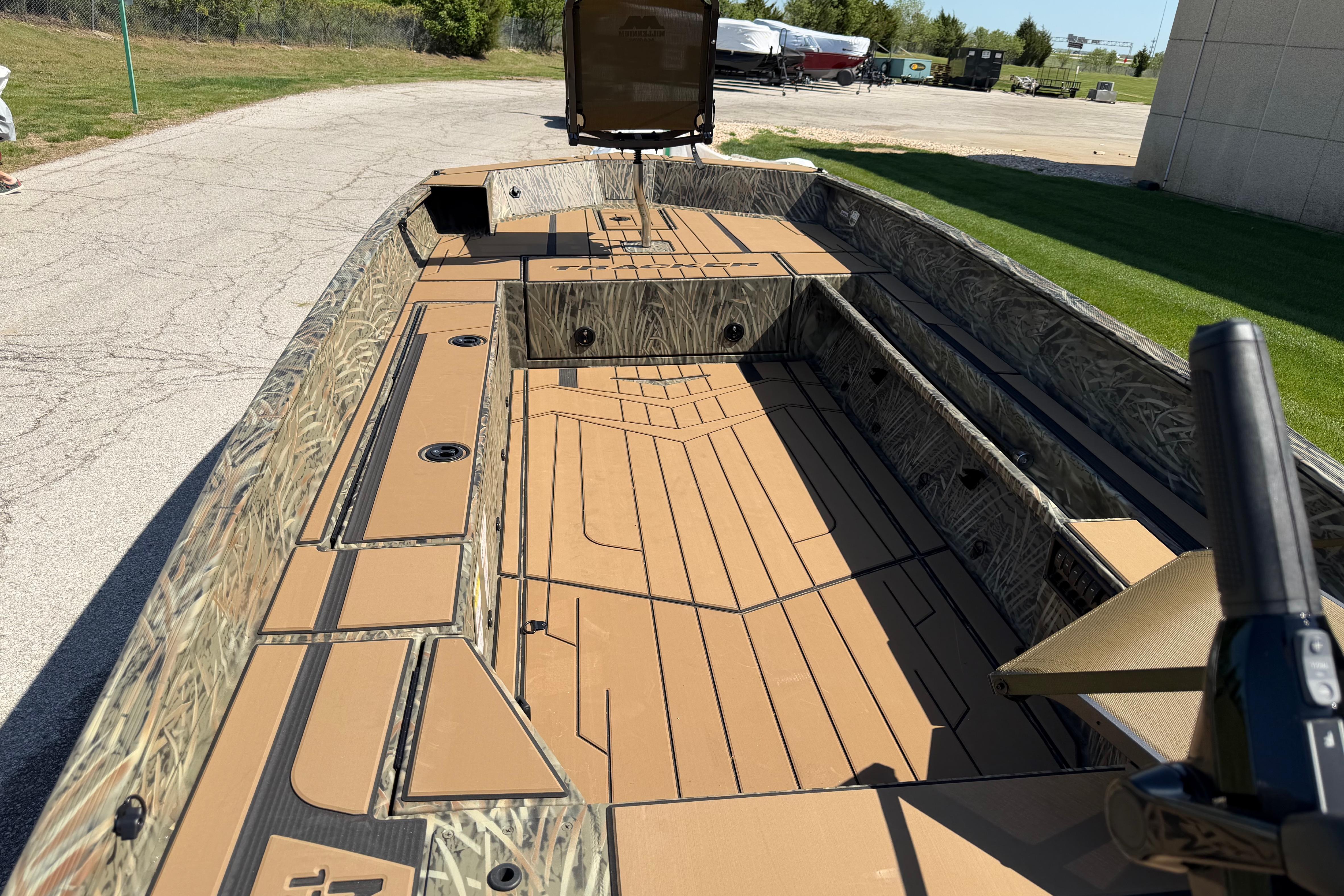 2026 Tracker Grizzly 1756 T Marsh boat with camo design and spacious deck.