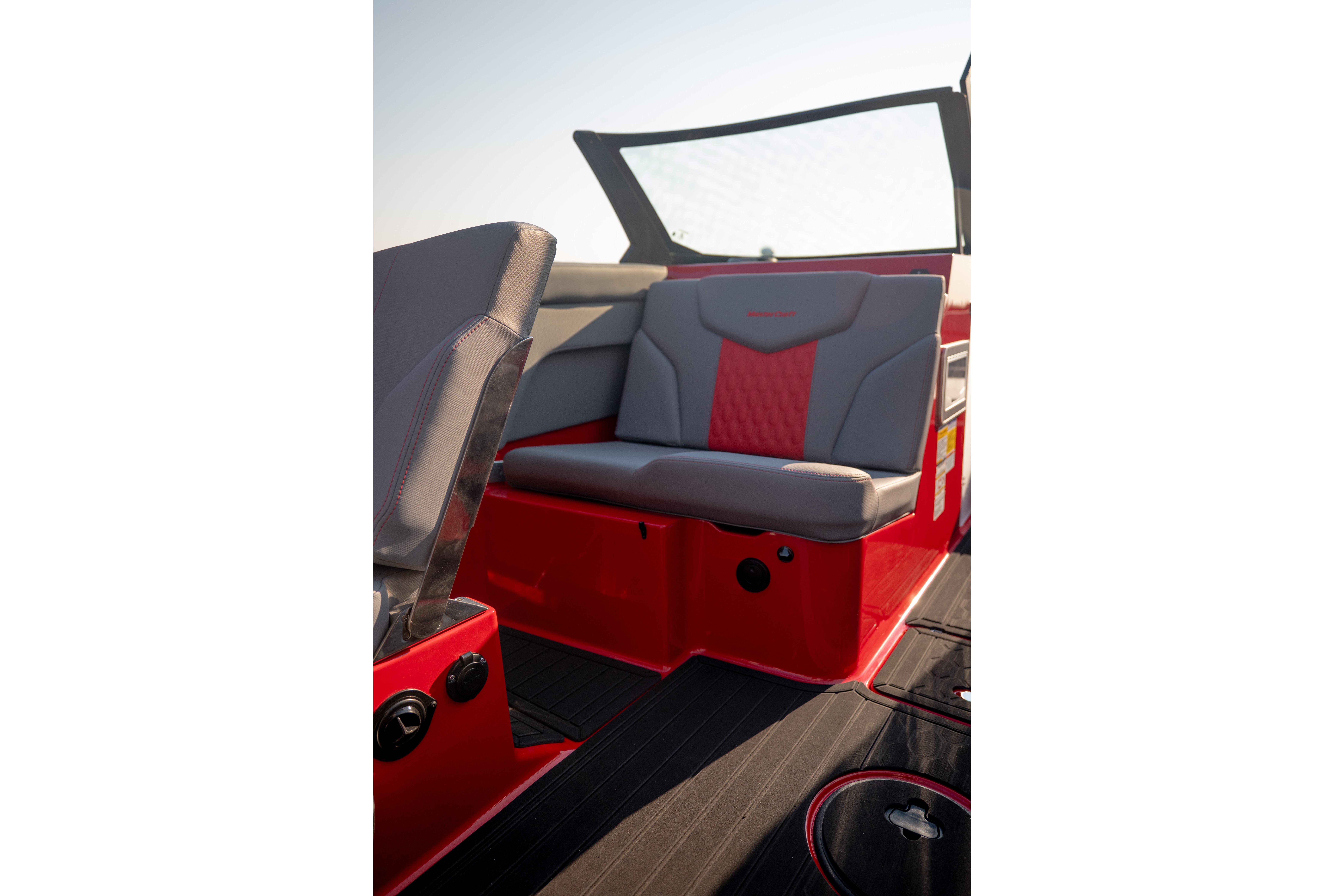 2027 MasterCraft XT24 boat interior with red and gray seating.