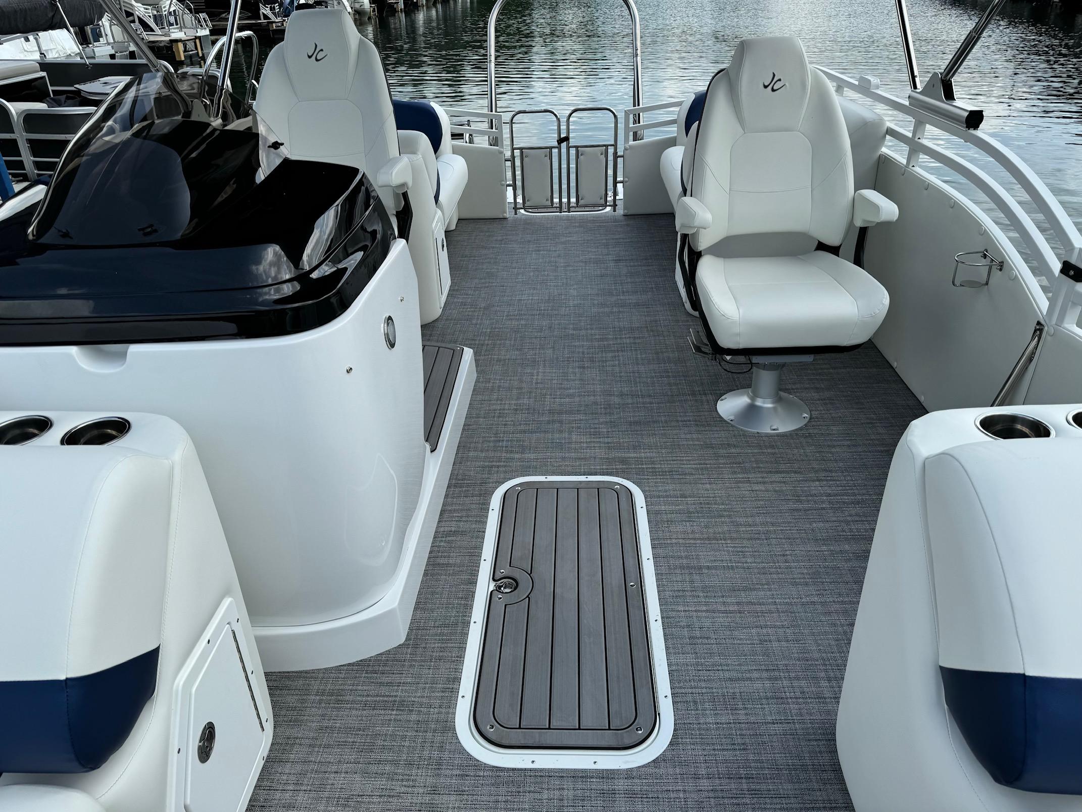 2024 JC Spirit Super Sport 24TT DSL boat interior with seating and storage compartments.