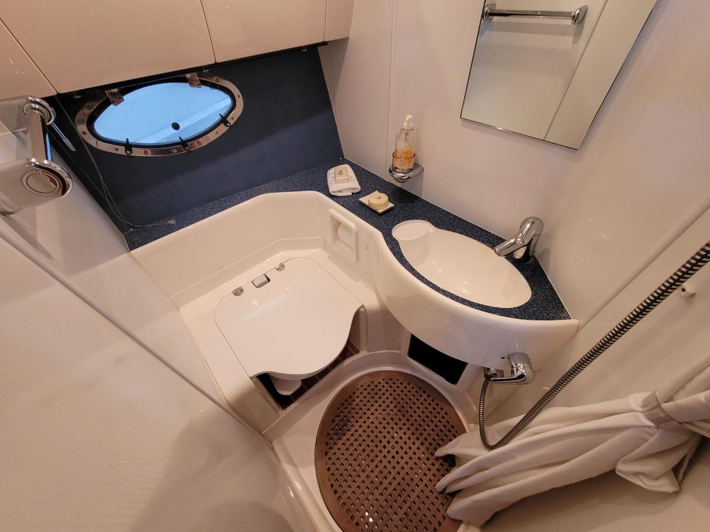 2004 Fairline Targa 43 yacht bathroom with sink, toilet, and shower.