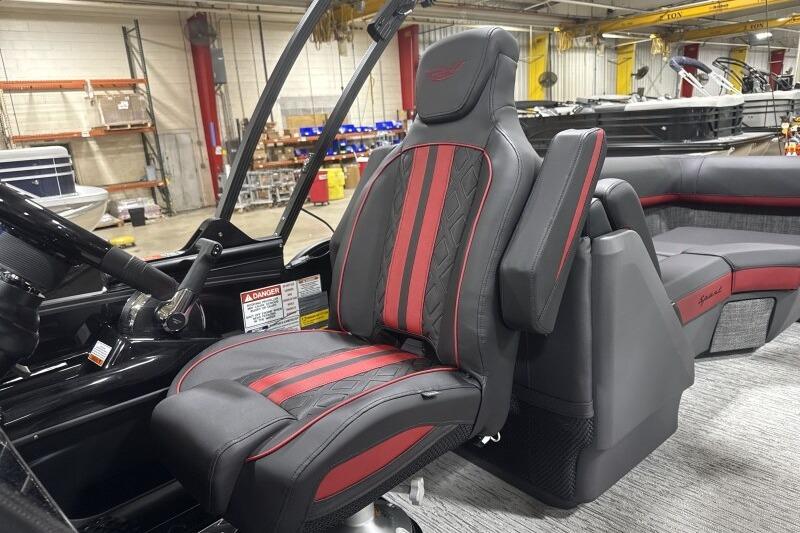 2026 Bennington 24 MFBSF boat interior with red and black captain's chair.