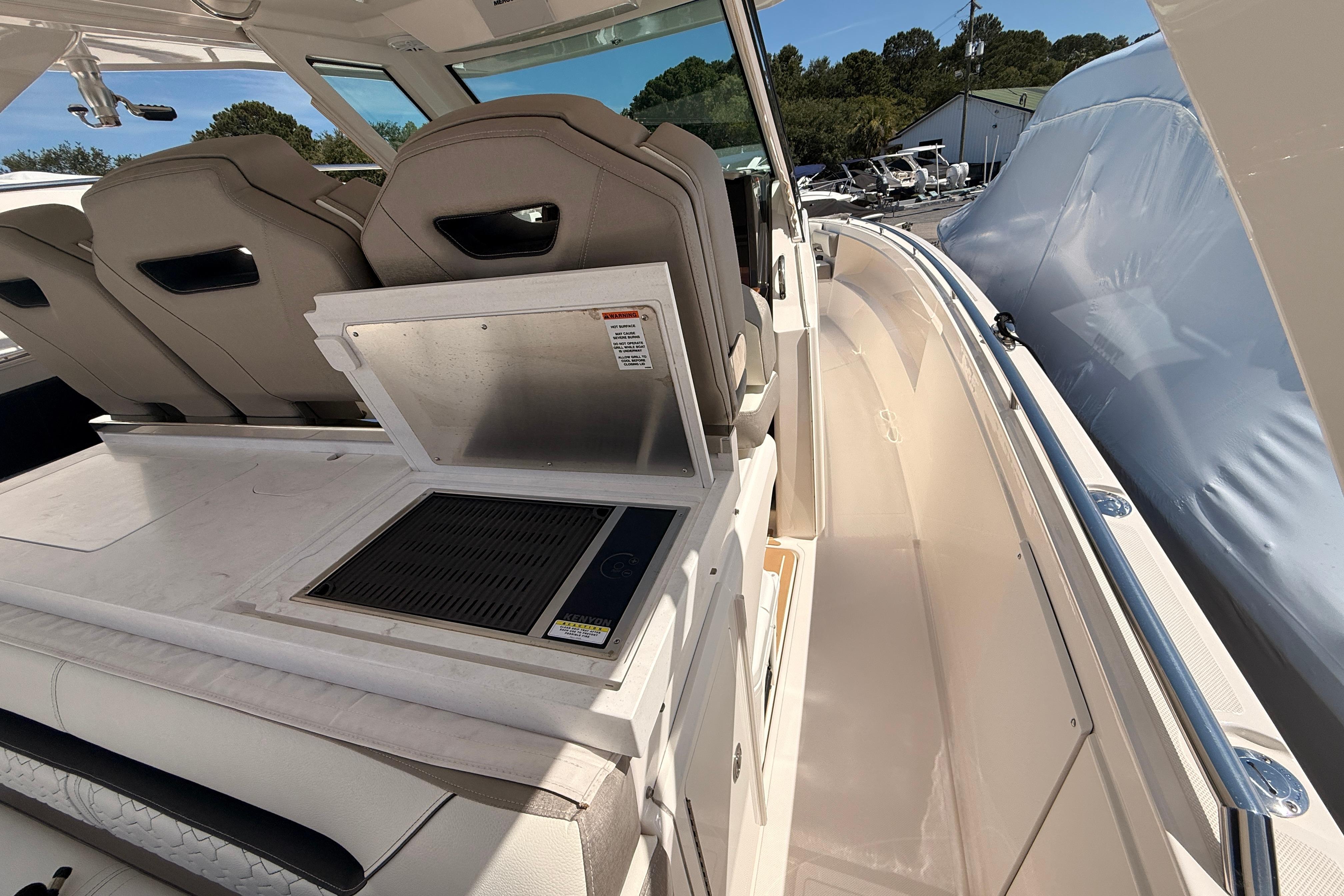 2024 Tiara Yachts 34 LS interior with seating and grill, showcasing luxury design.