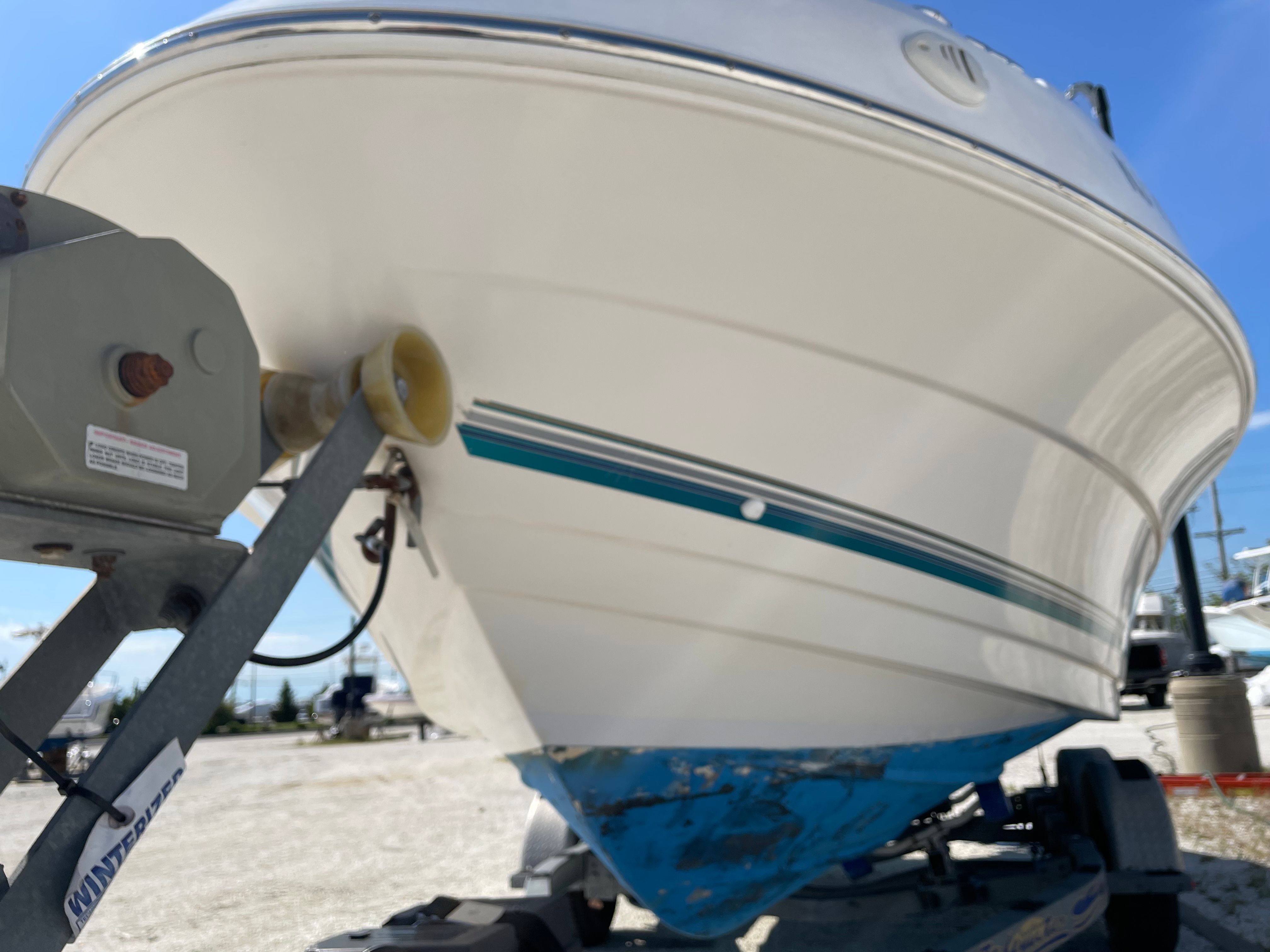 2005 Aquasport 210 Osprey boat on trailer.