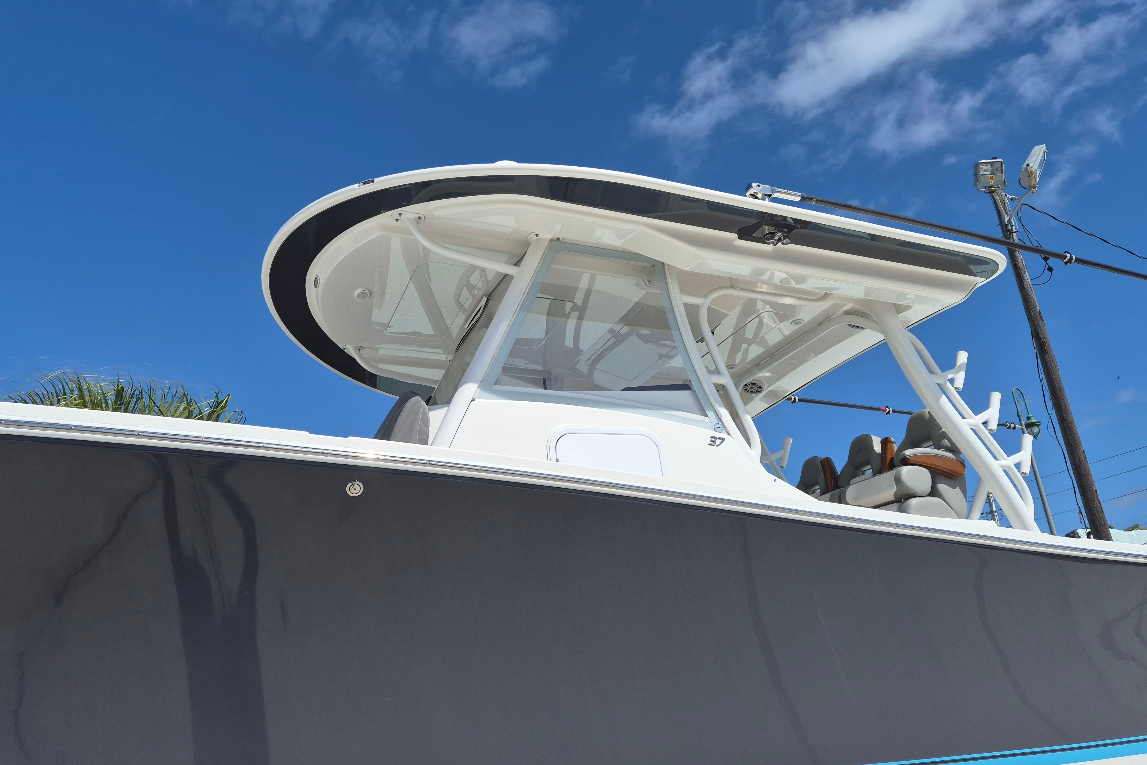 2024 Regulator 37 boat with sleek design under clear blue sky.