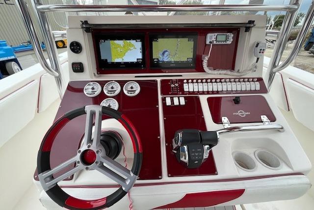 2001 Fountain 38 Center Console boat dashboard with navigation screens and controls.