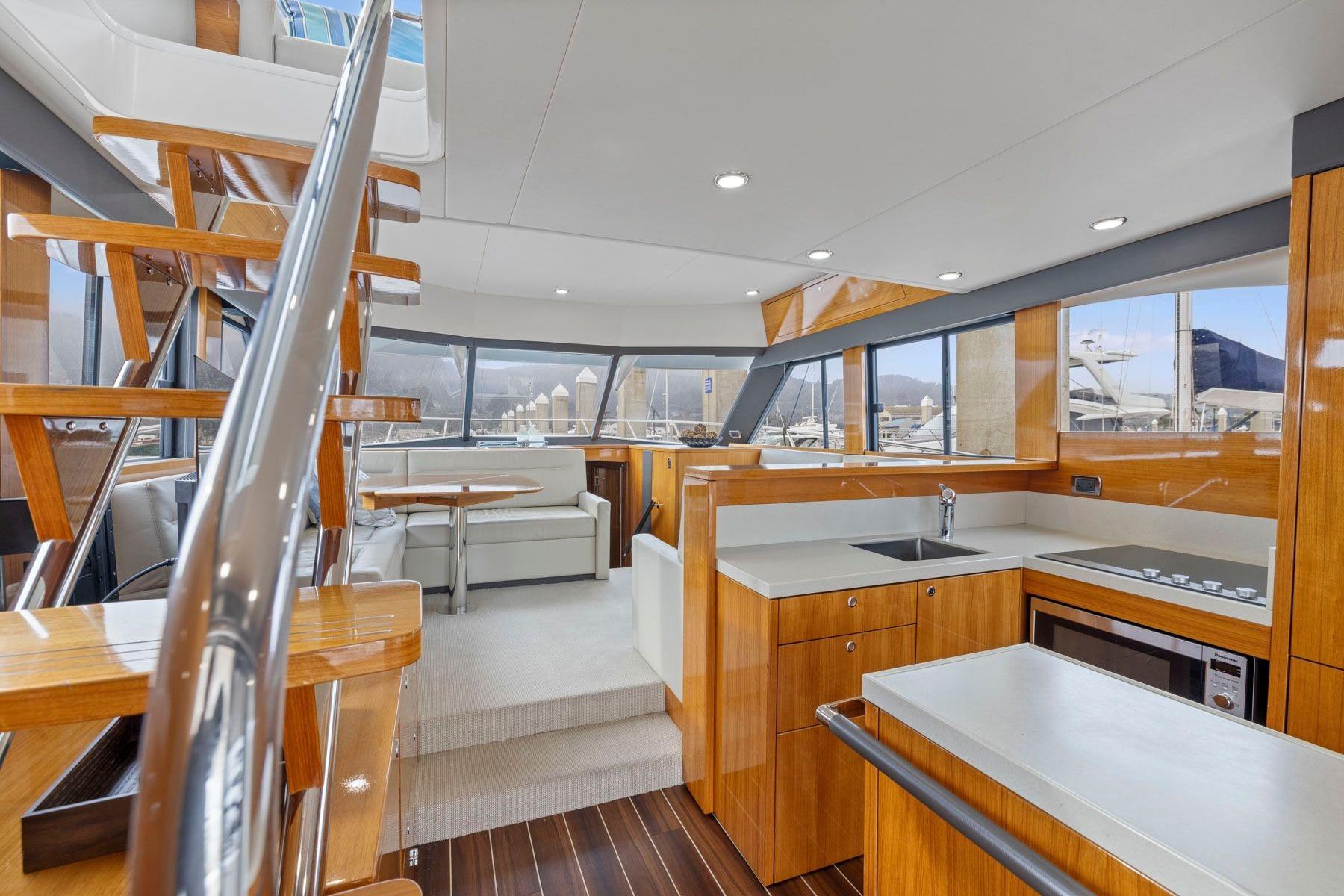 Luxurious interior of 2014 Maritimo M50 yacht with modern kitchen and seating area.