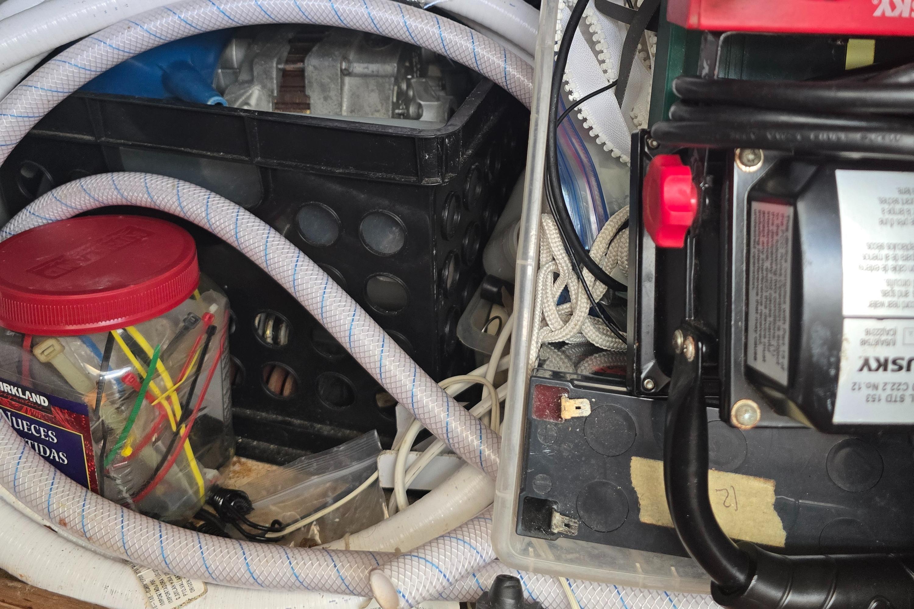 Interior of a 1978 Herreshoff 50 boat showing storage and equipment.