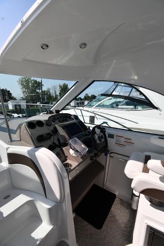 2010 Cruisers Yachts 390 Sports Coupe helm with modern controls and seating.