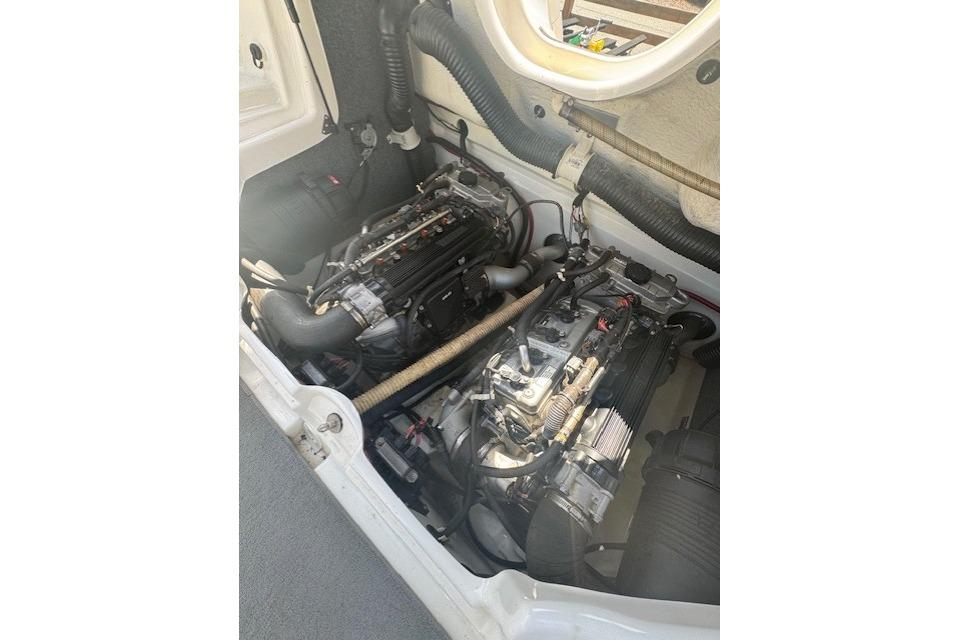 2012 Yamaha AR210 engine compartment with dual engines and visible components.