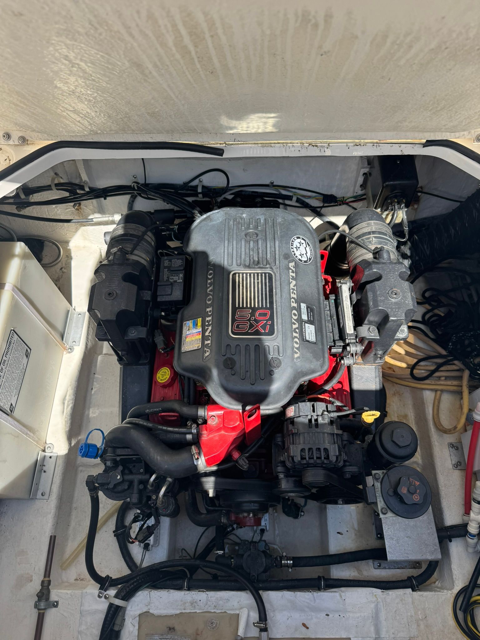 A boat engine with V8 branding in an open engine compartment.