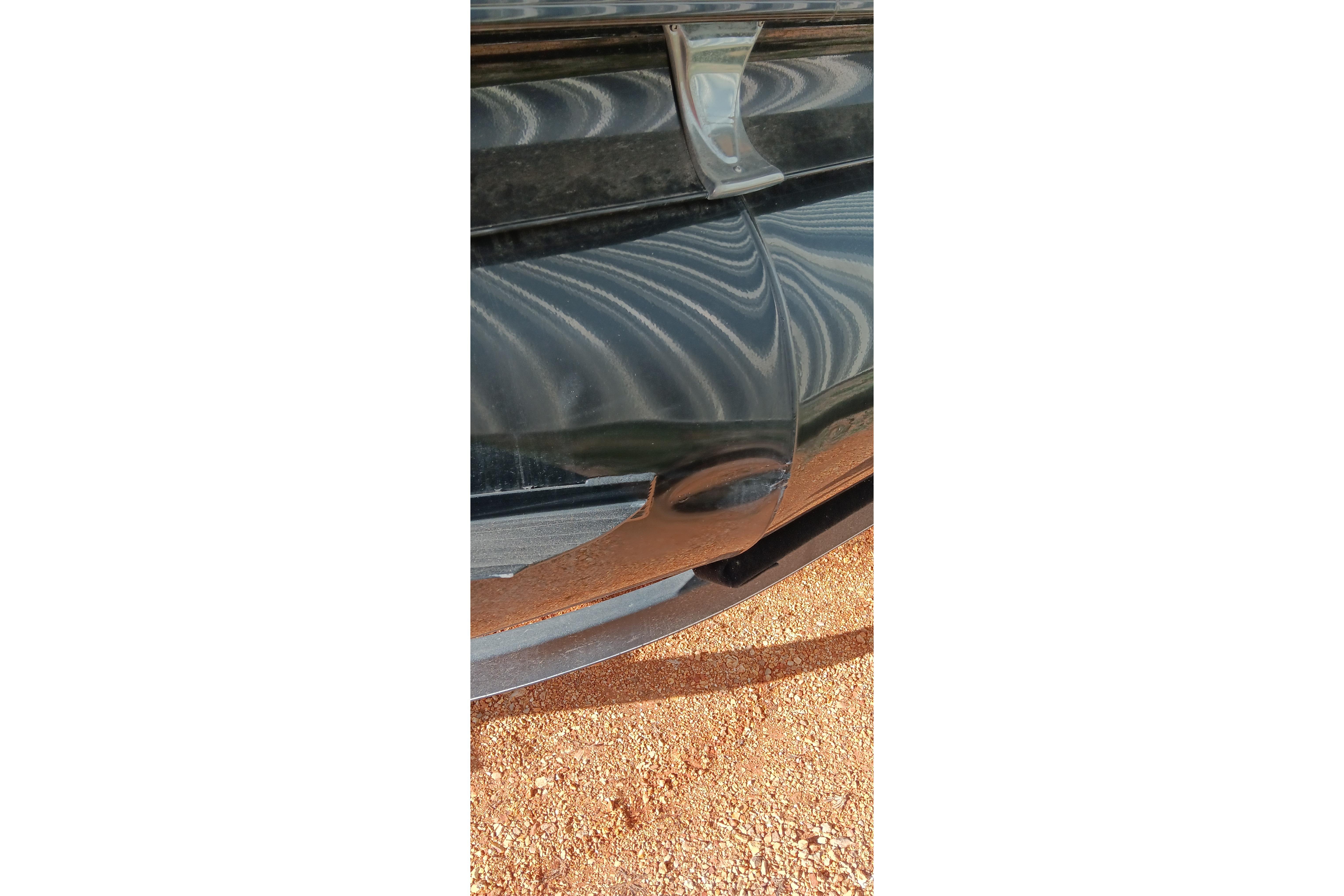 Close-up of a 2023 Ranger 2500LS boat hull on a sandy surface.