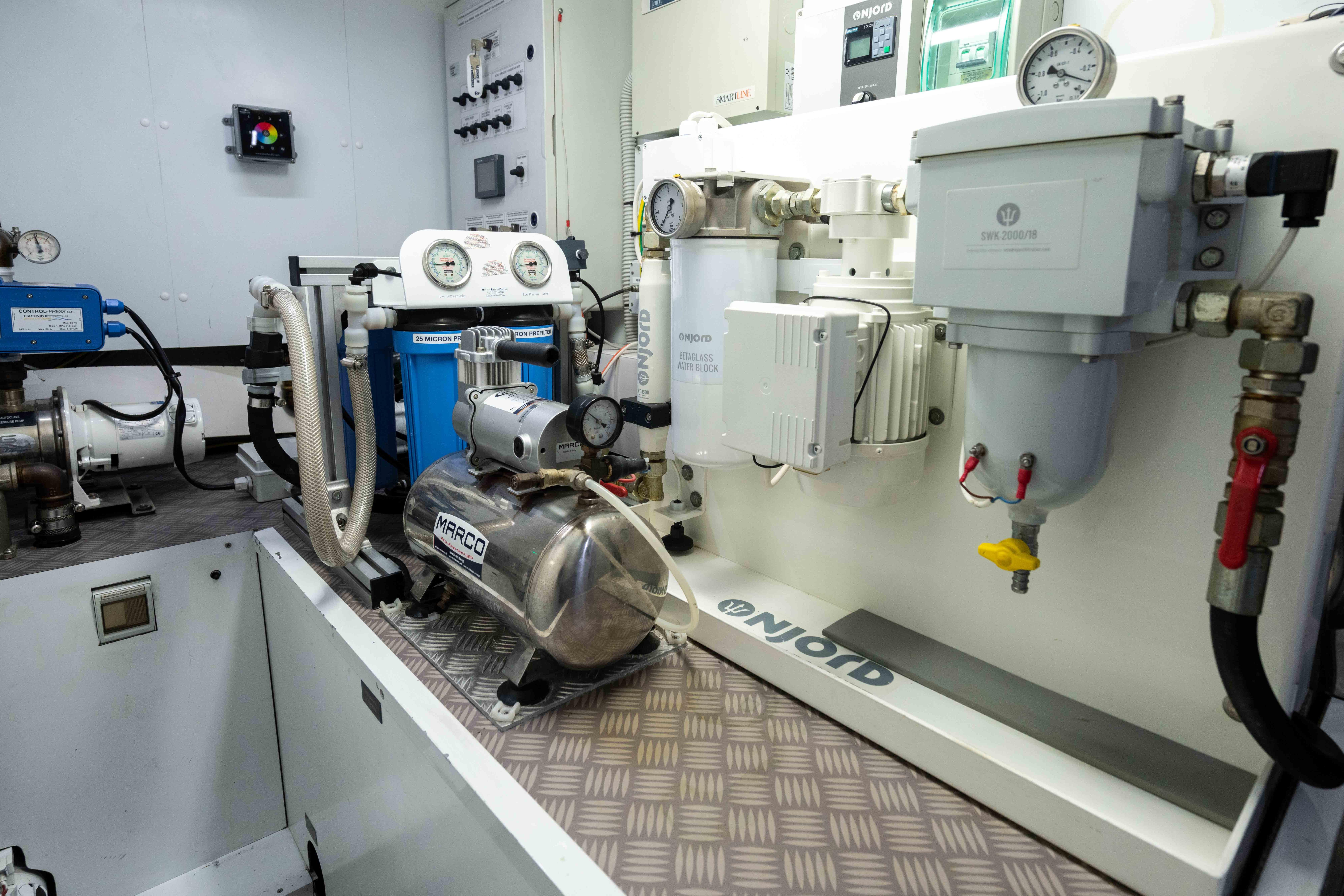 Engine room of a 2017 Pershing 74 yacht, featuring advanced mechanical equipment.