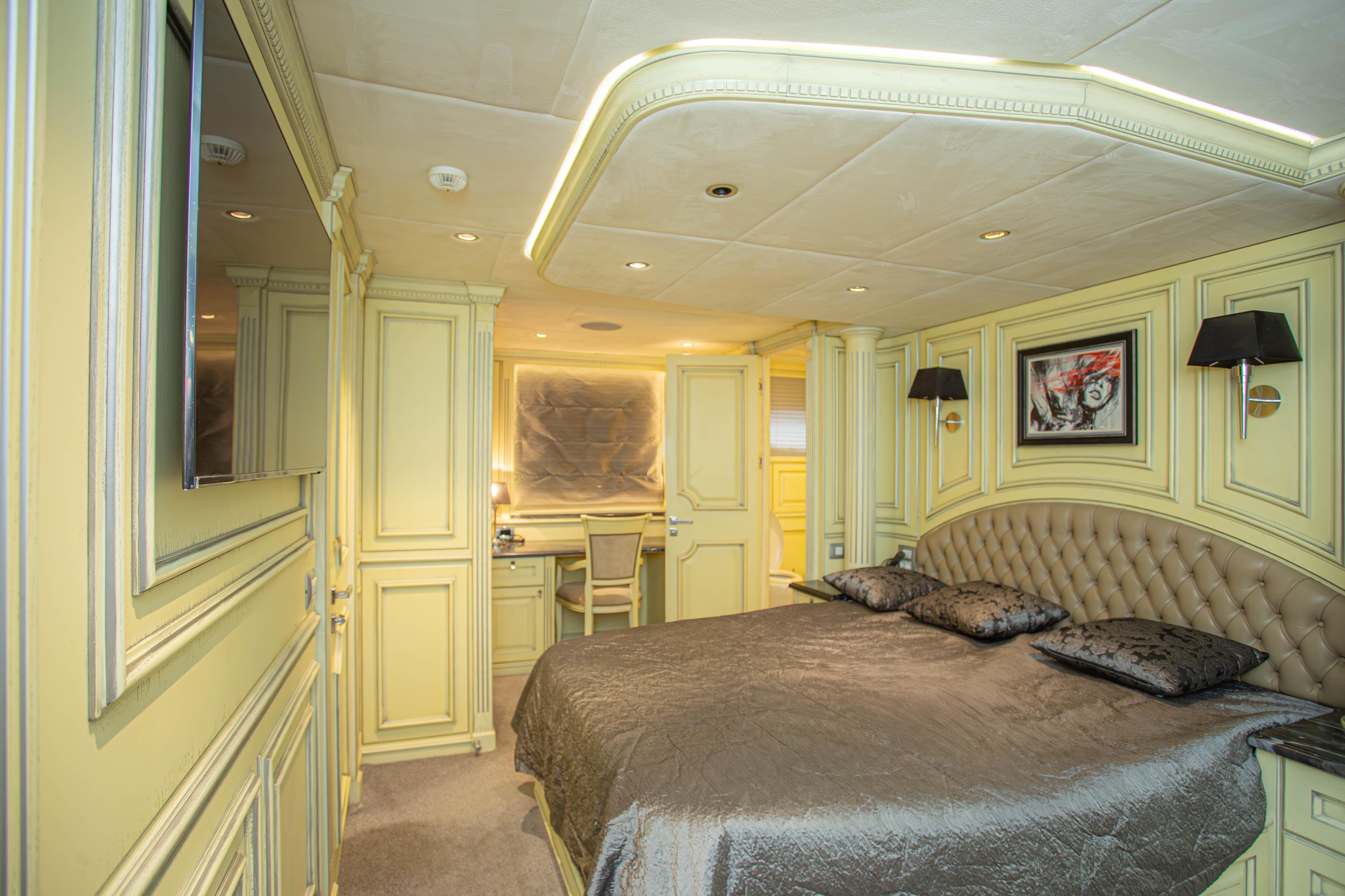 Luxurious bedroom interior of 2014 Fifth Ocean Yachts 24m Displacement Explorer Yacht.